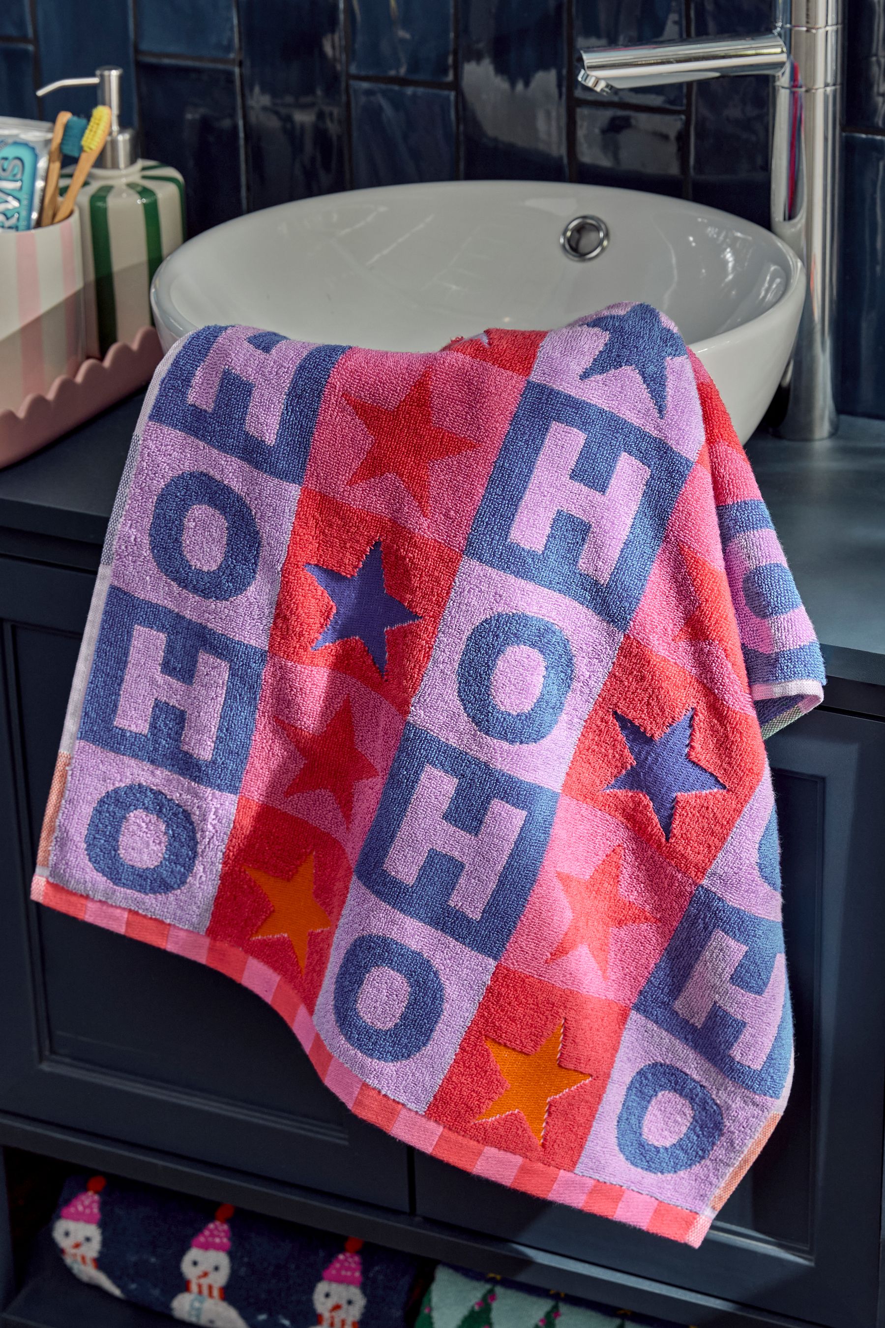 Buy Multi Bright Christmas Slogan 100 Cotton Towels from Next Luxembourg