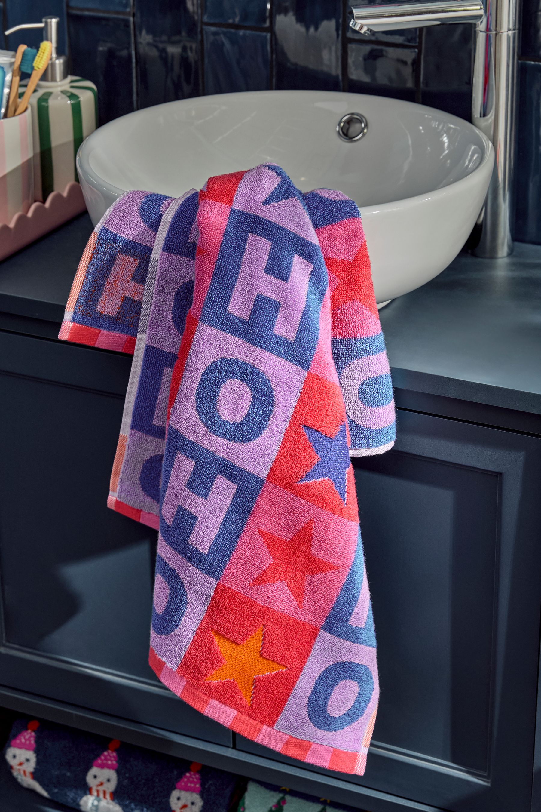 Buy Multi Bright Christmas Slogan 100 Cotton Towels from Next Ireland