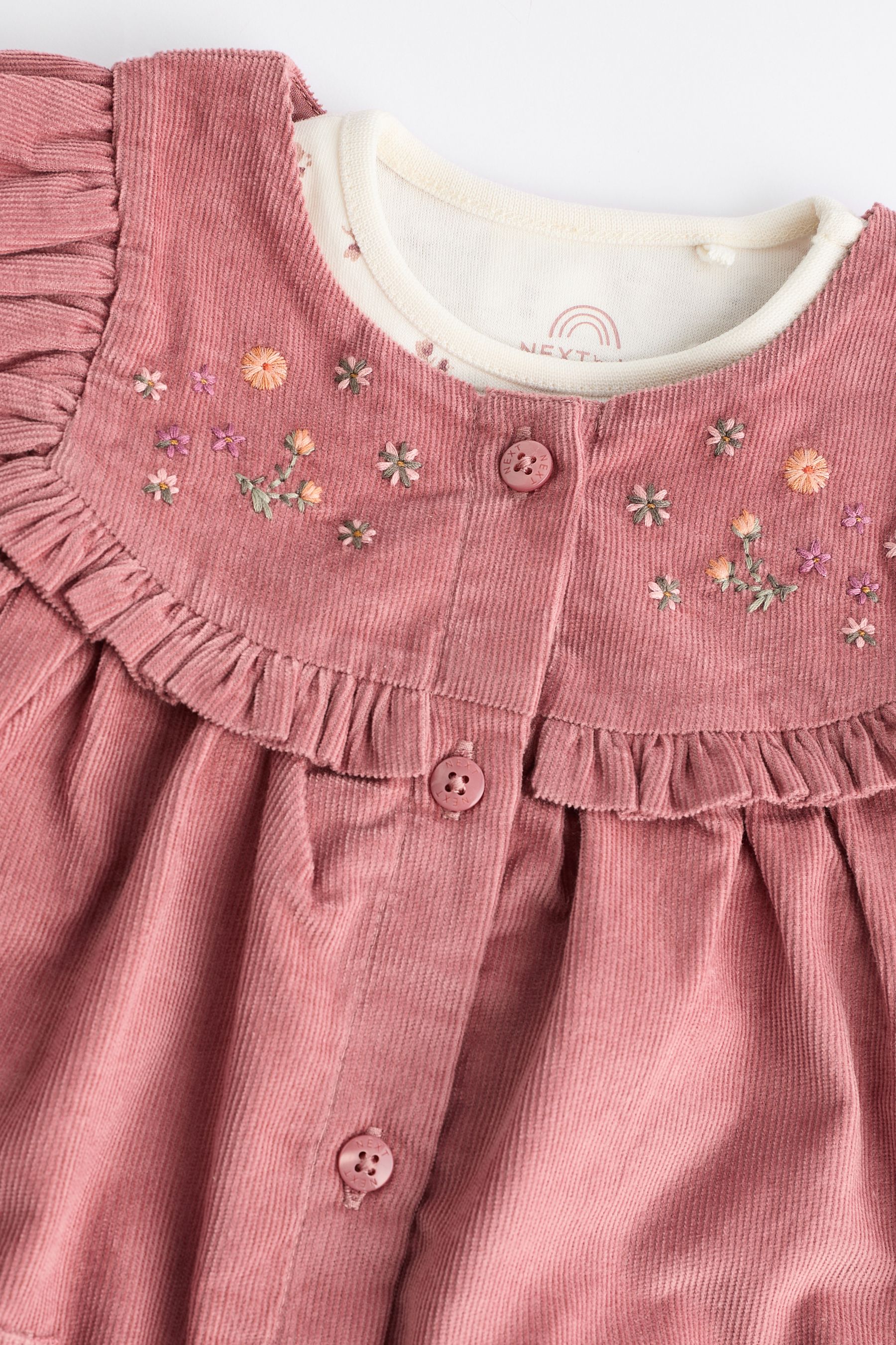 Baby pink pinafore dress top
