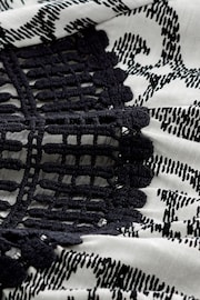 Black/White Print Short Sleeve Crochet Bubblehem Top - Image 6 of 6