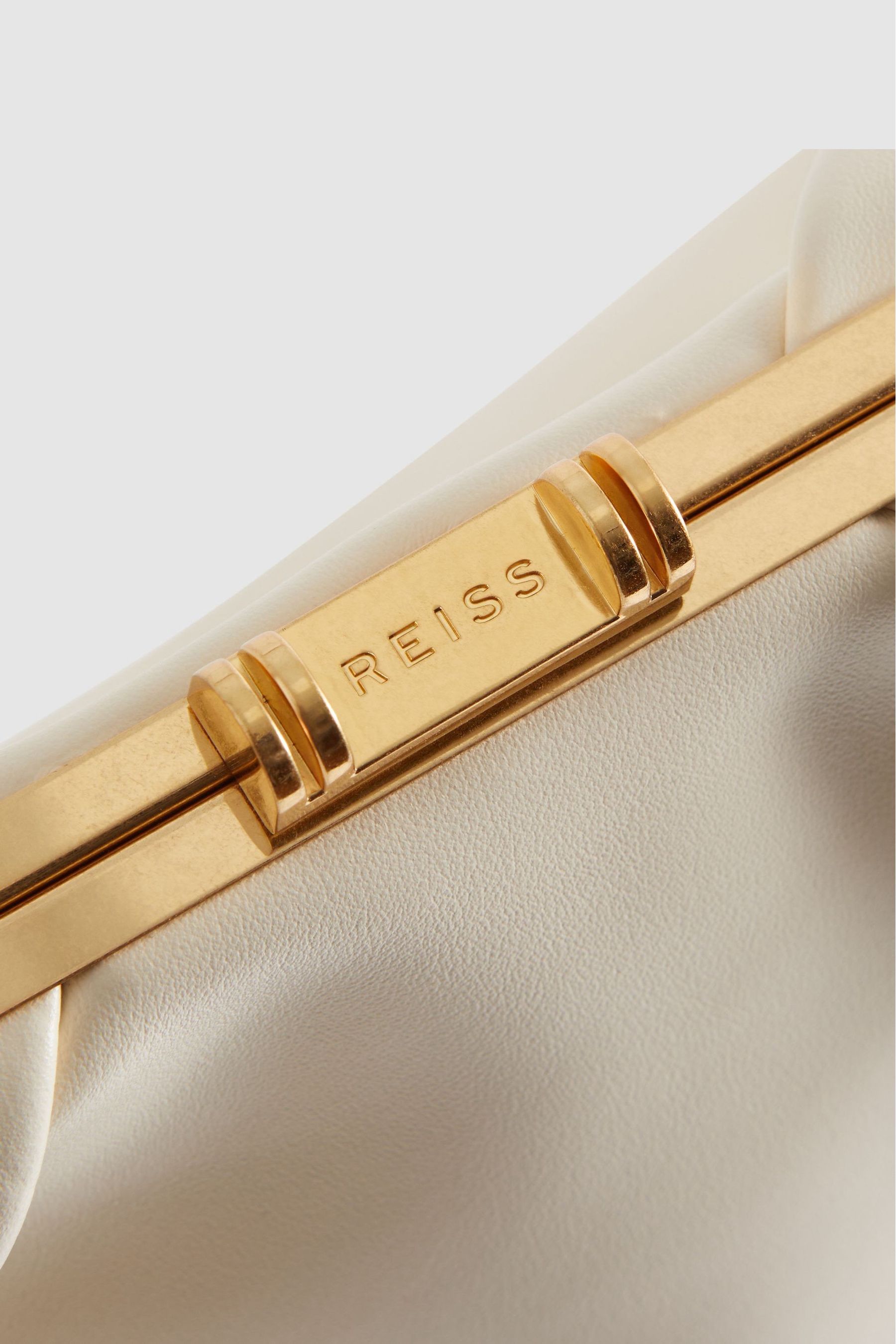 Off white clutch bag discount