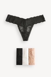 Victoria's Secret Black/Nude/White Thong 4 Pack Knickers - Image 1 of 5