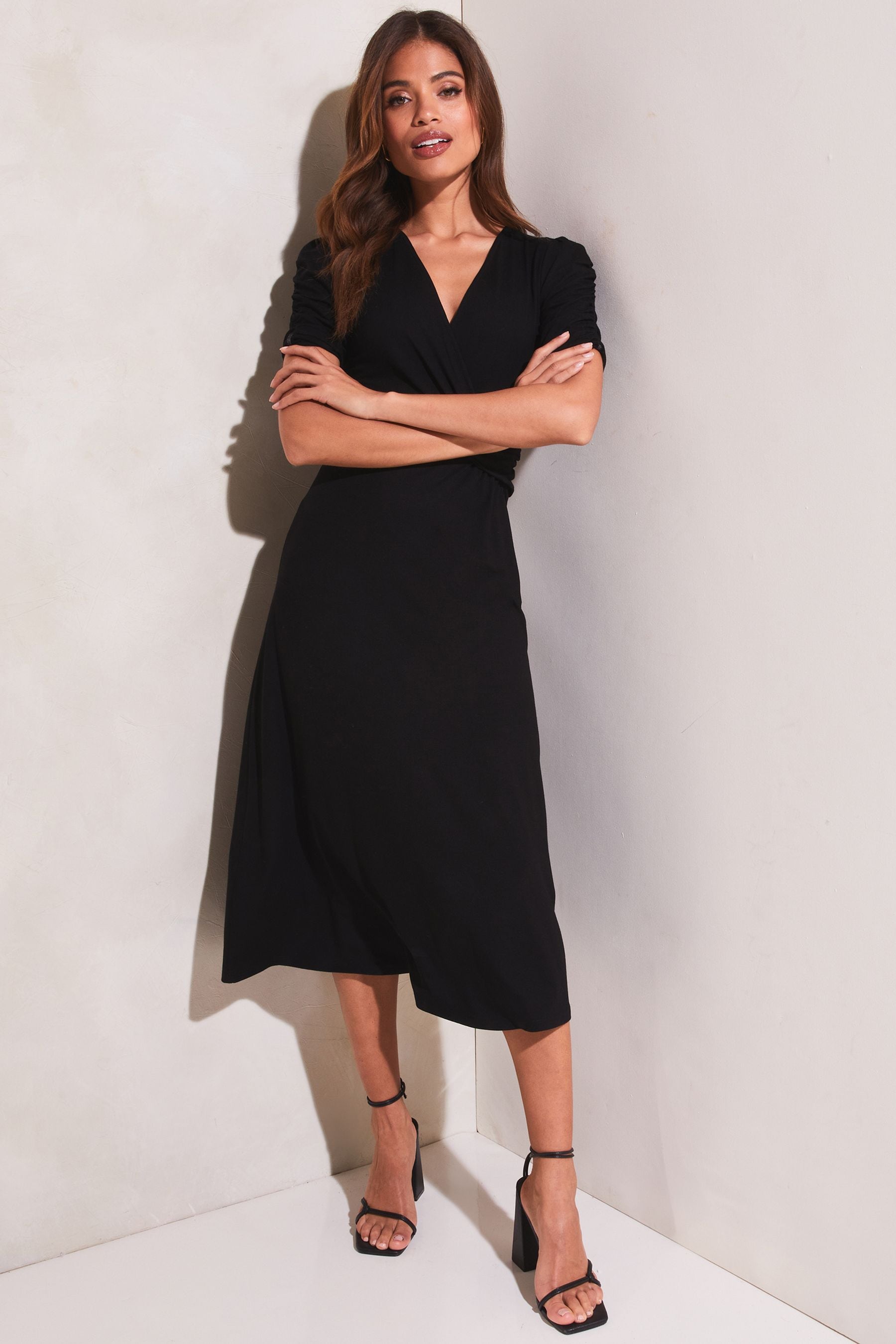 Buy Lipsy Black Jersey Short Ruched Sleeve Knot Side Midi Dress from the Next UK online shop