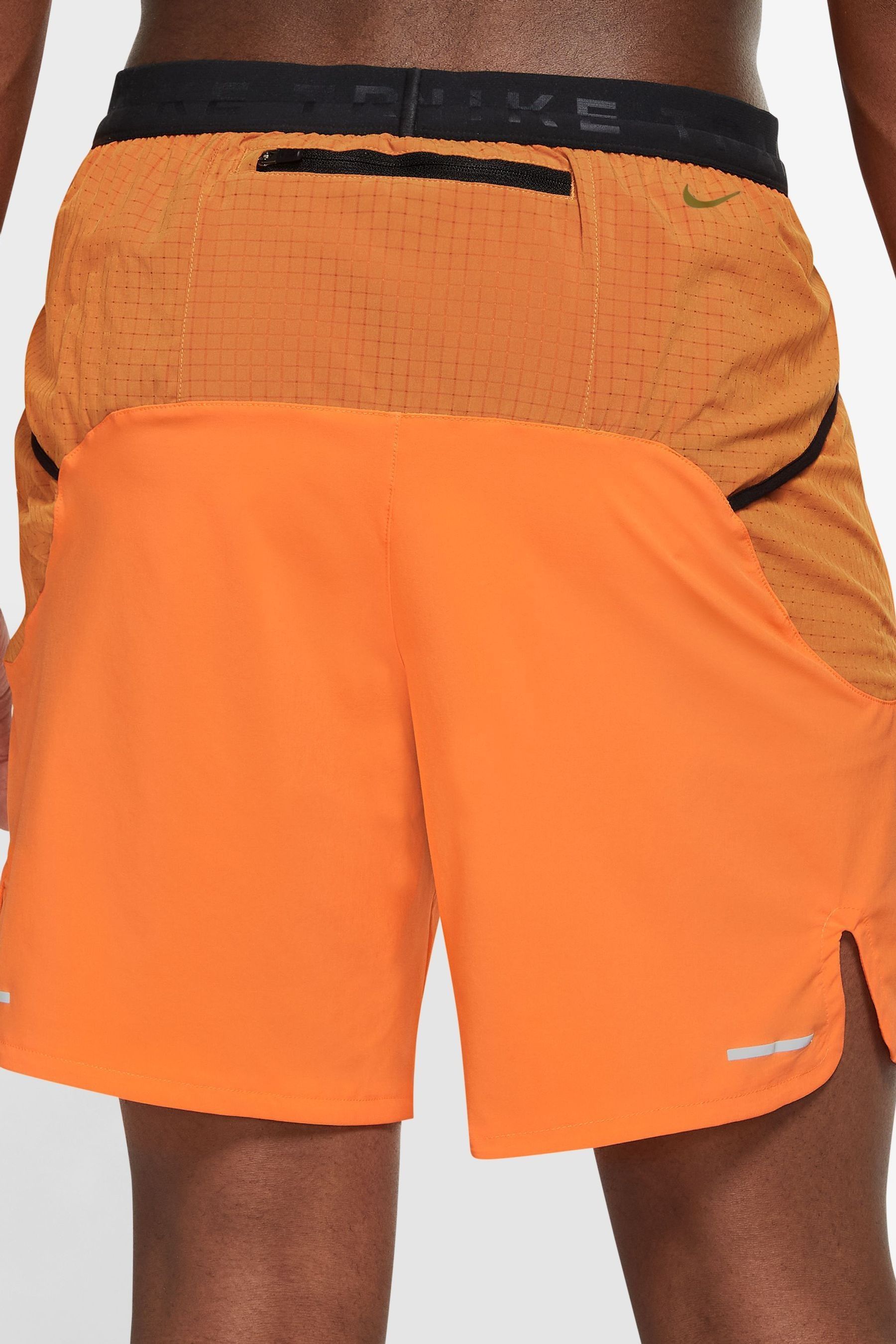 Nike running shorts orange deals