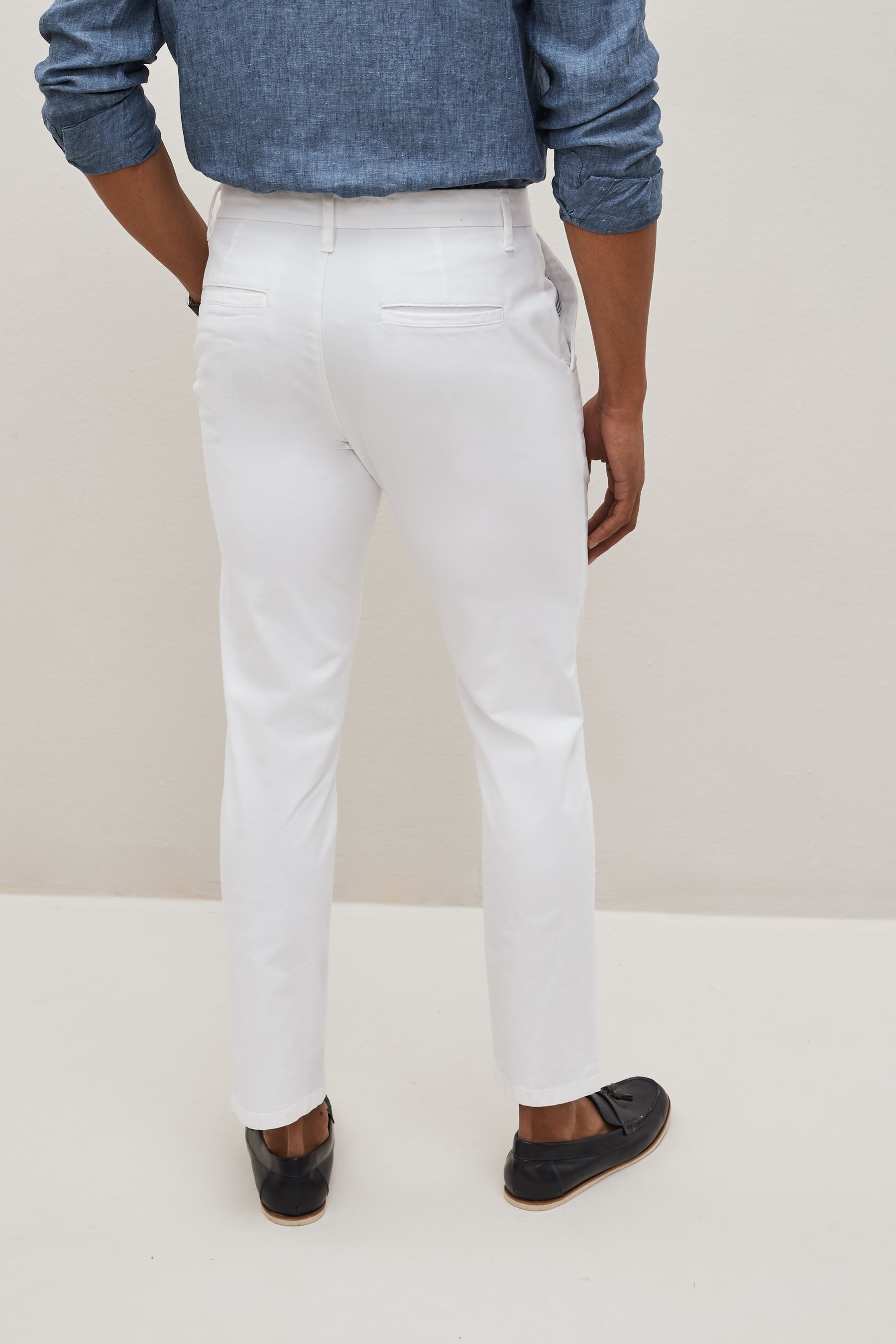 Buy White Slim Fit Stretch Chinos Trousers from the Next UK online shop
