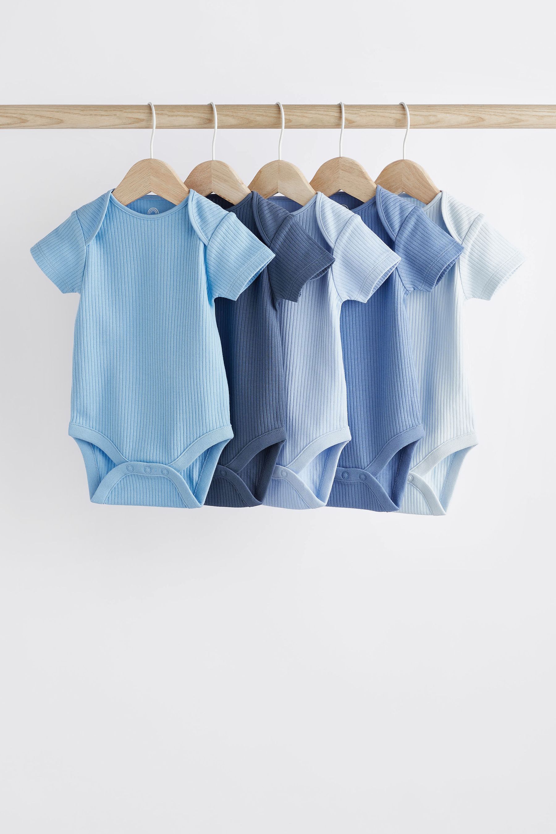 Buy Blue Plain Rib Baby Bodysuits 5 Pack from the Next UK online shop