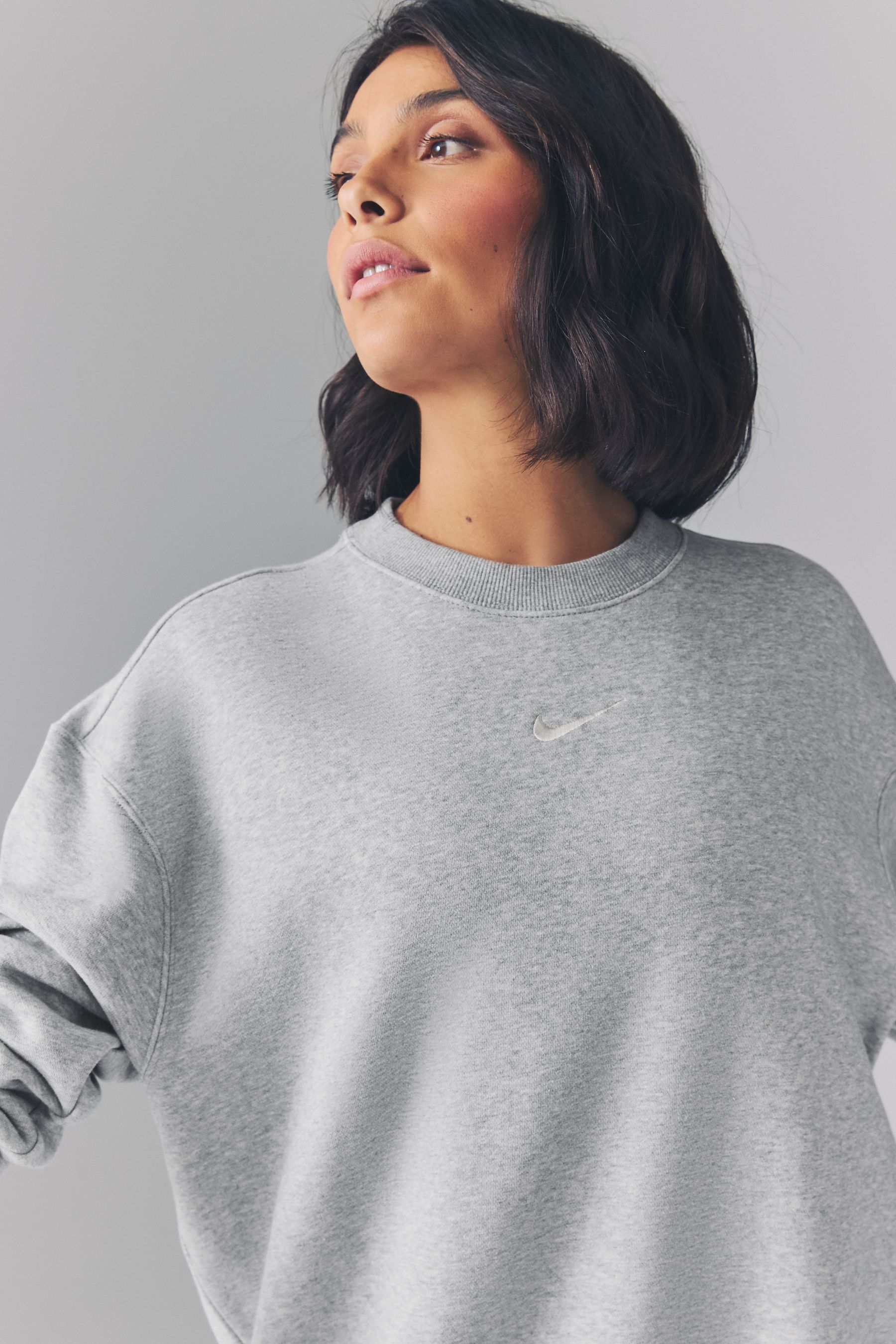 Buy Nike Dark Grey Heather Oversized Mini Swoosh Sweatshirt from the Next UK online shop