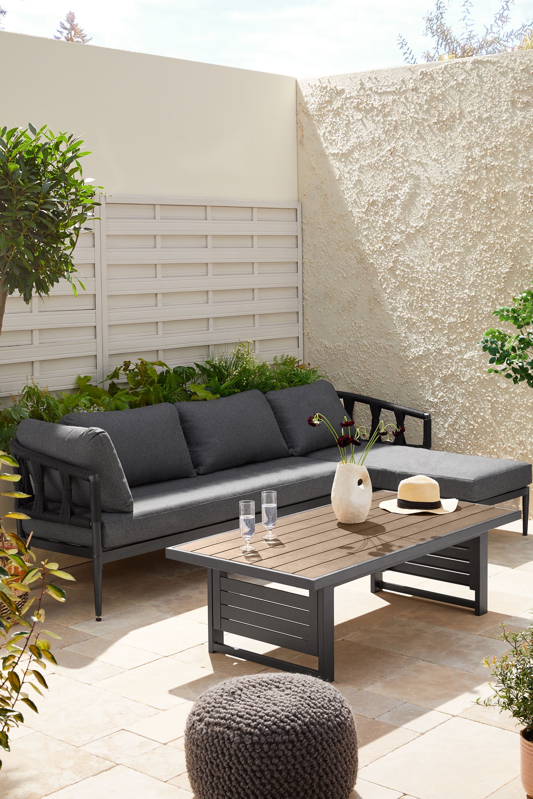 Buy Black Sorrento Garden Sofa Chaise and Rising Table Dining Set from the Next UK online shop