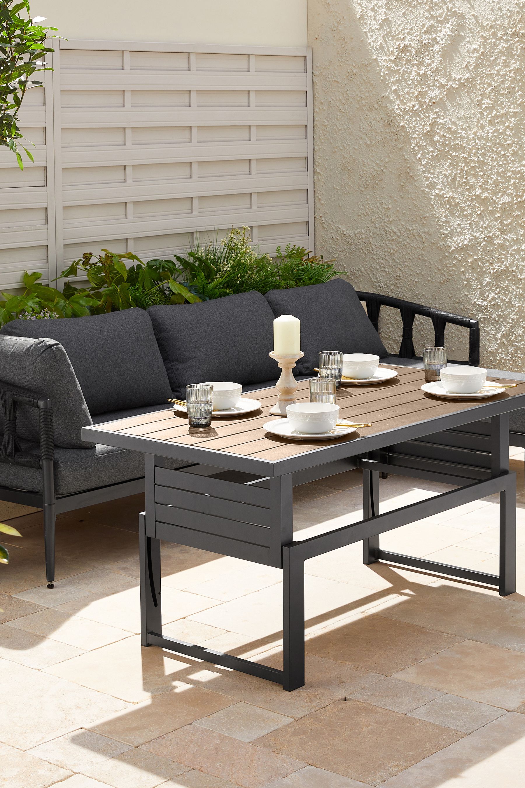 Buy Black Sorrento Garden Sofa Chaise and Rising Table Dining Set from the Next UK online shop