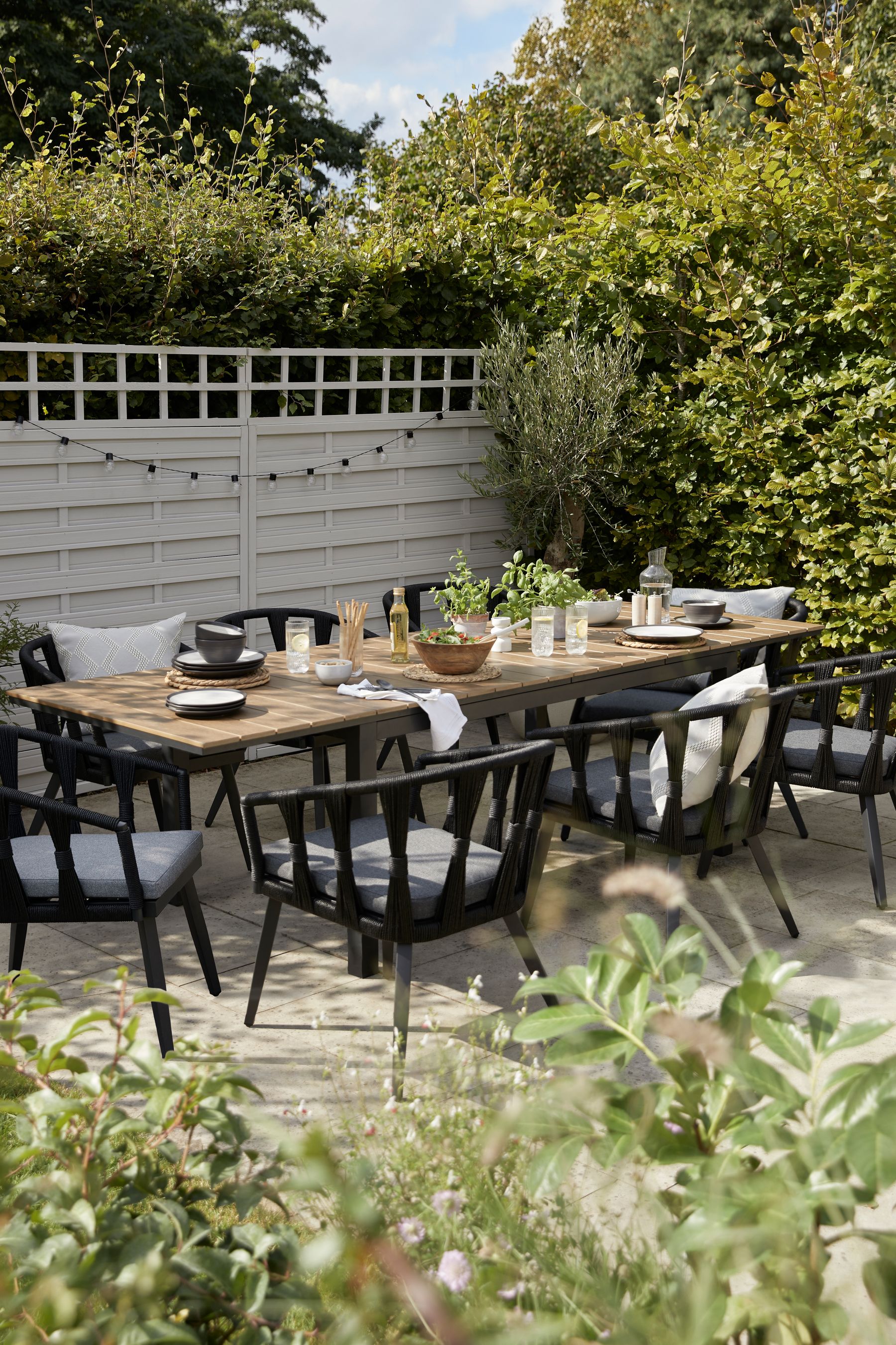 Buy Black Sorrento Garden 6 To 8 Seater Extending Dining Table and Chairs Set from the Next UK online shop