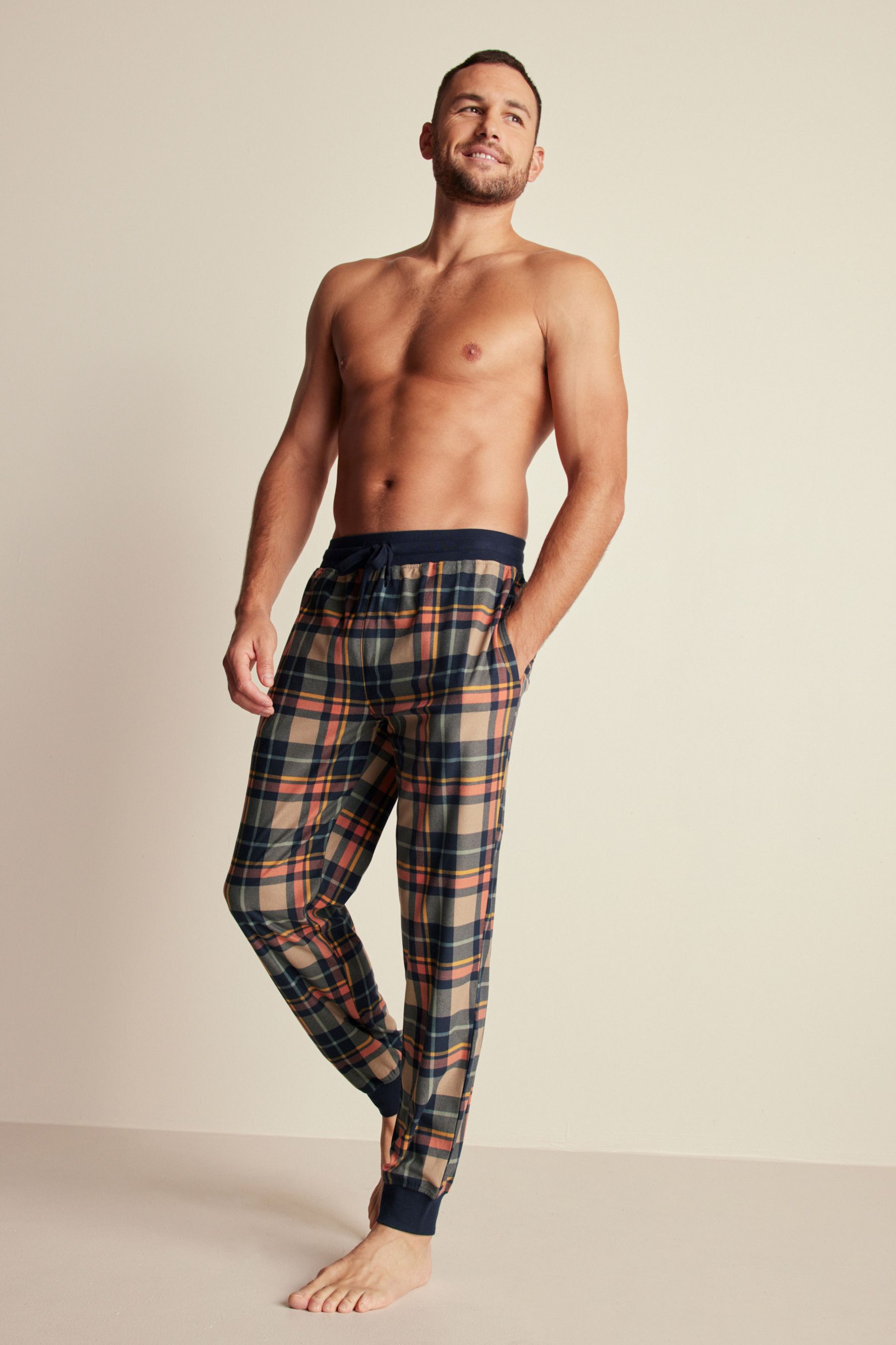 Buy Navy Blue Neutral Check Motion Flex Cosy Cuffed Pyjama Bottoms from Next Qatar