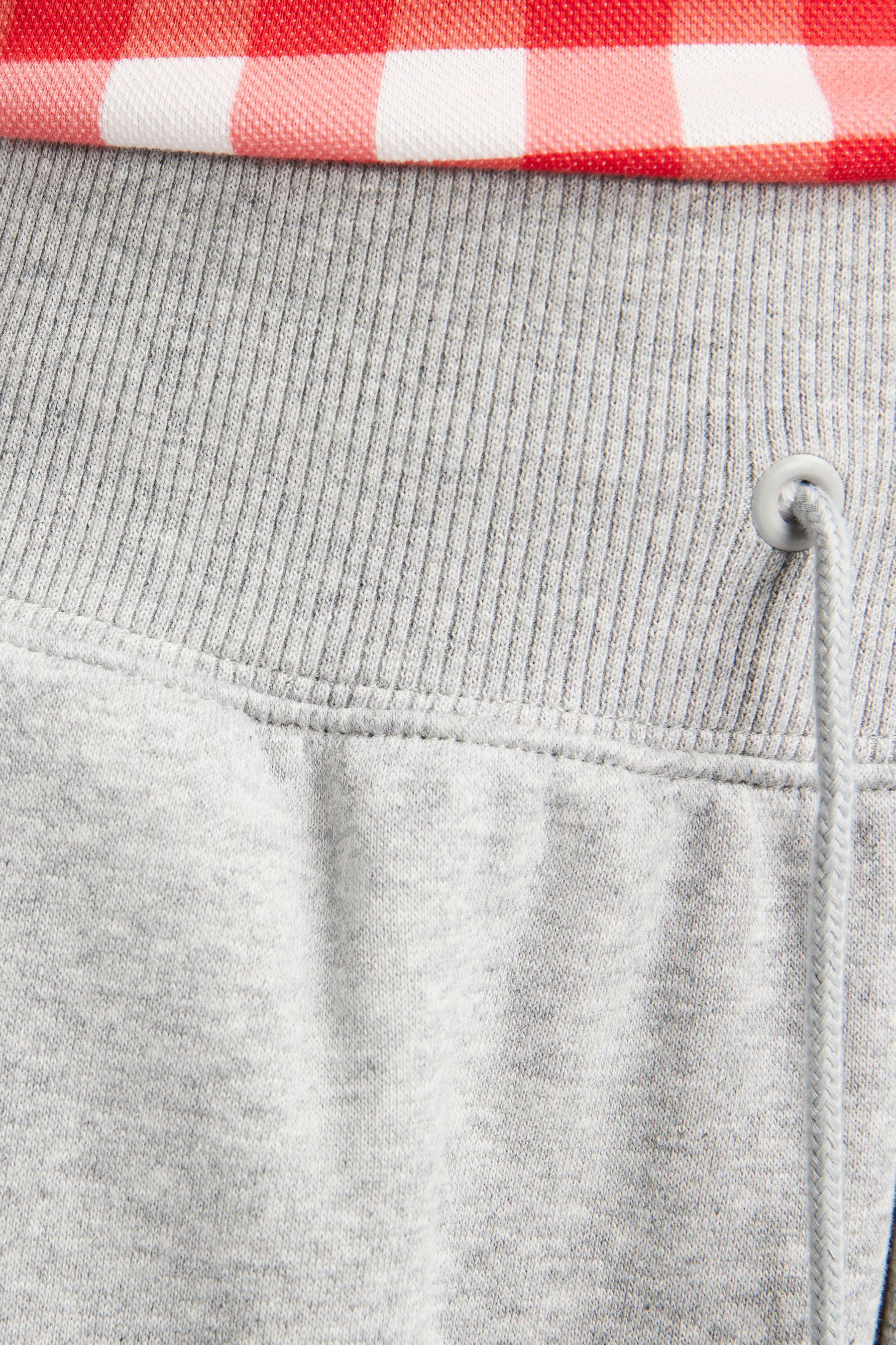 Nike mini swoosh oversized sweatpants in gray discount