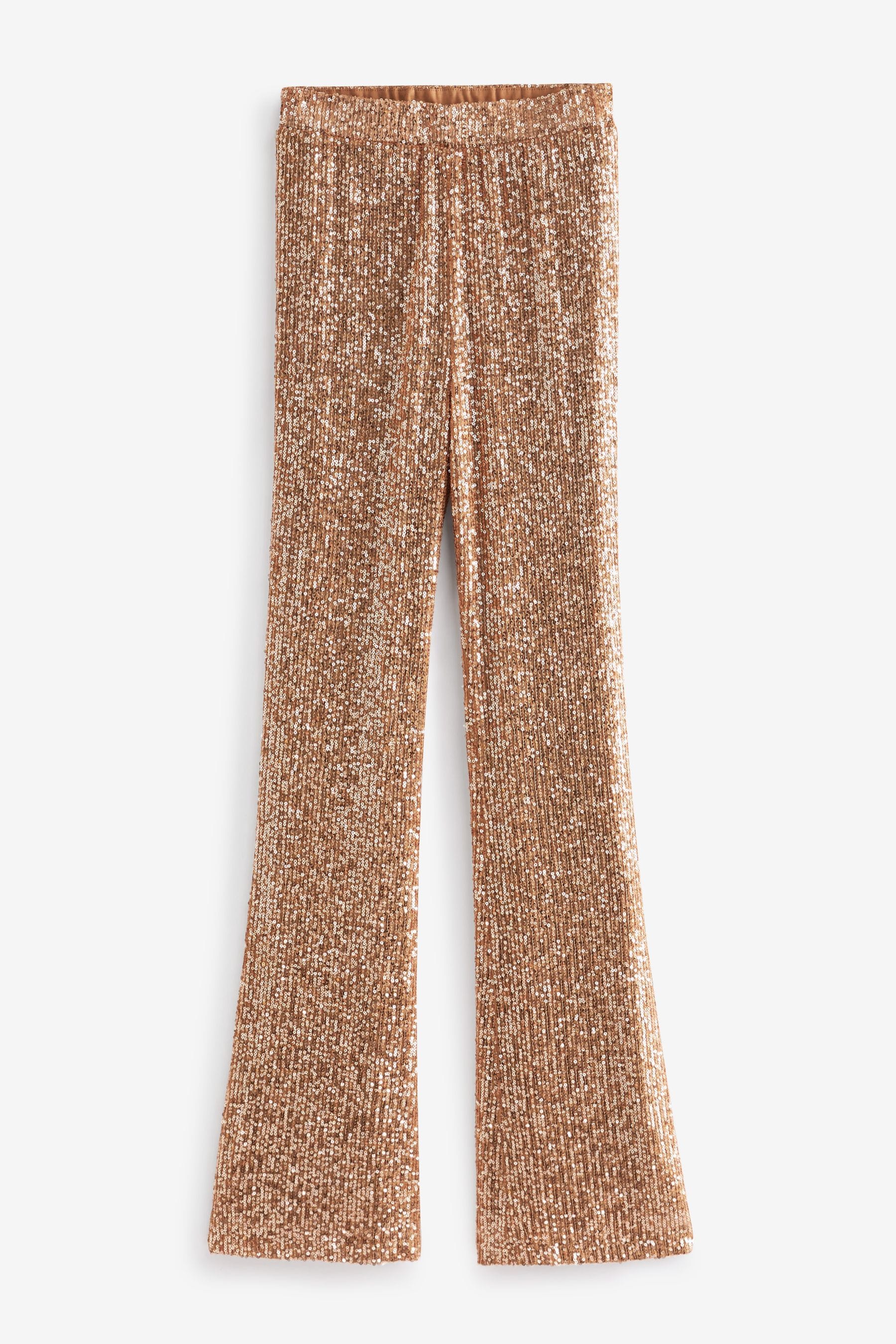Gold flared trousers top