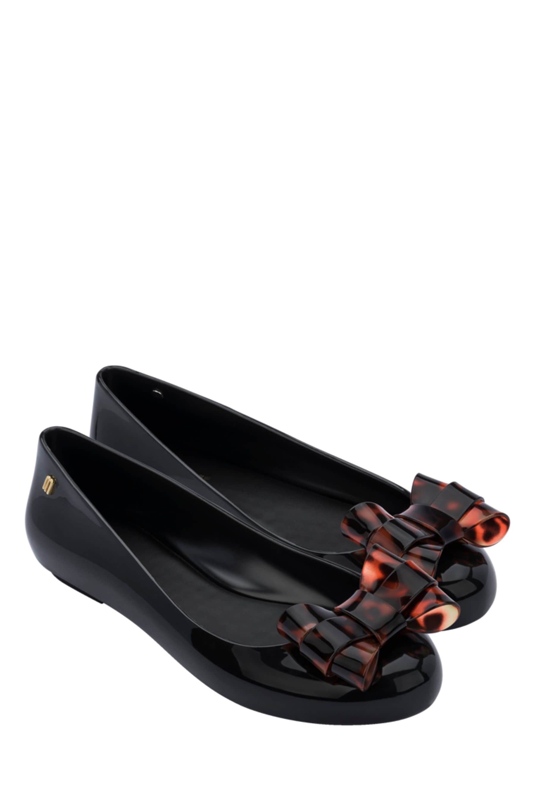 Buy Melissa Black Tortoiseshell Bow Pumps from Next Luxembourg