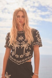 Black and Gold Palm Print Broderie Short Sleeve Top - Image 1 of 6