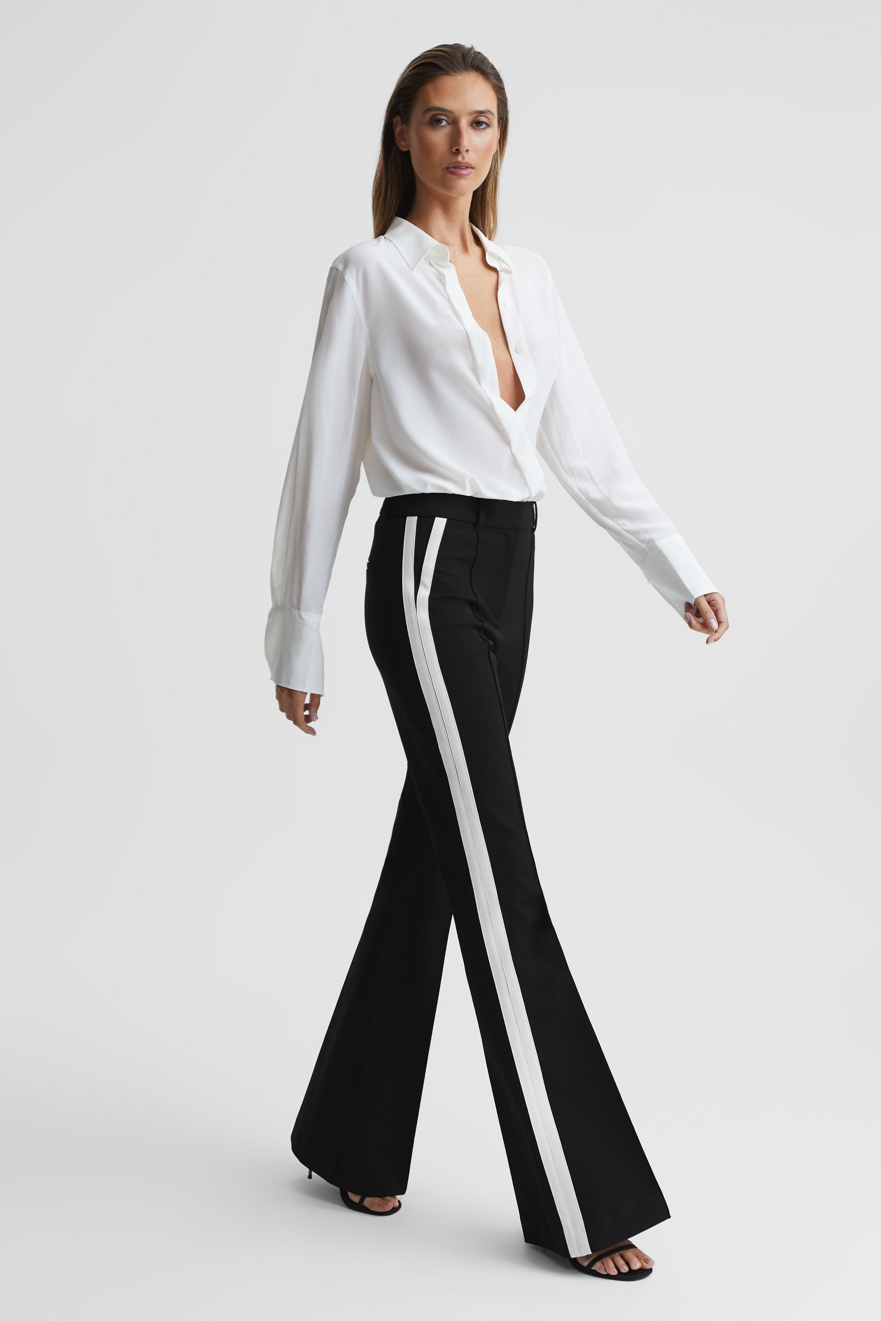 Buy Reiss Black Amie Petite Flared Side Stripe Trousers from Next Lithuania