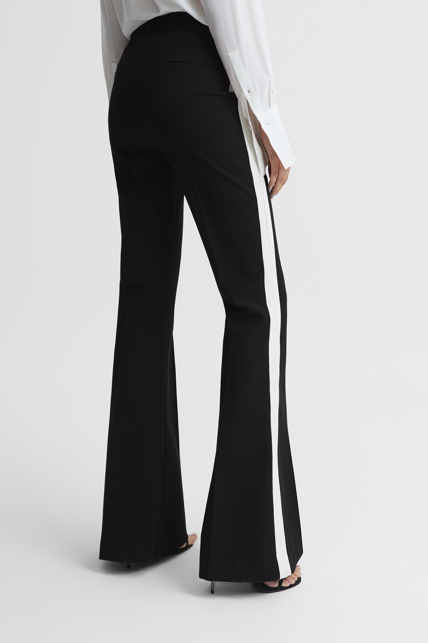 Buy Reiss Black Amie Petite Flared Side Stripe Trousers from Next Lithuania