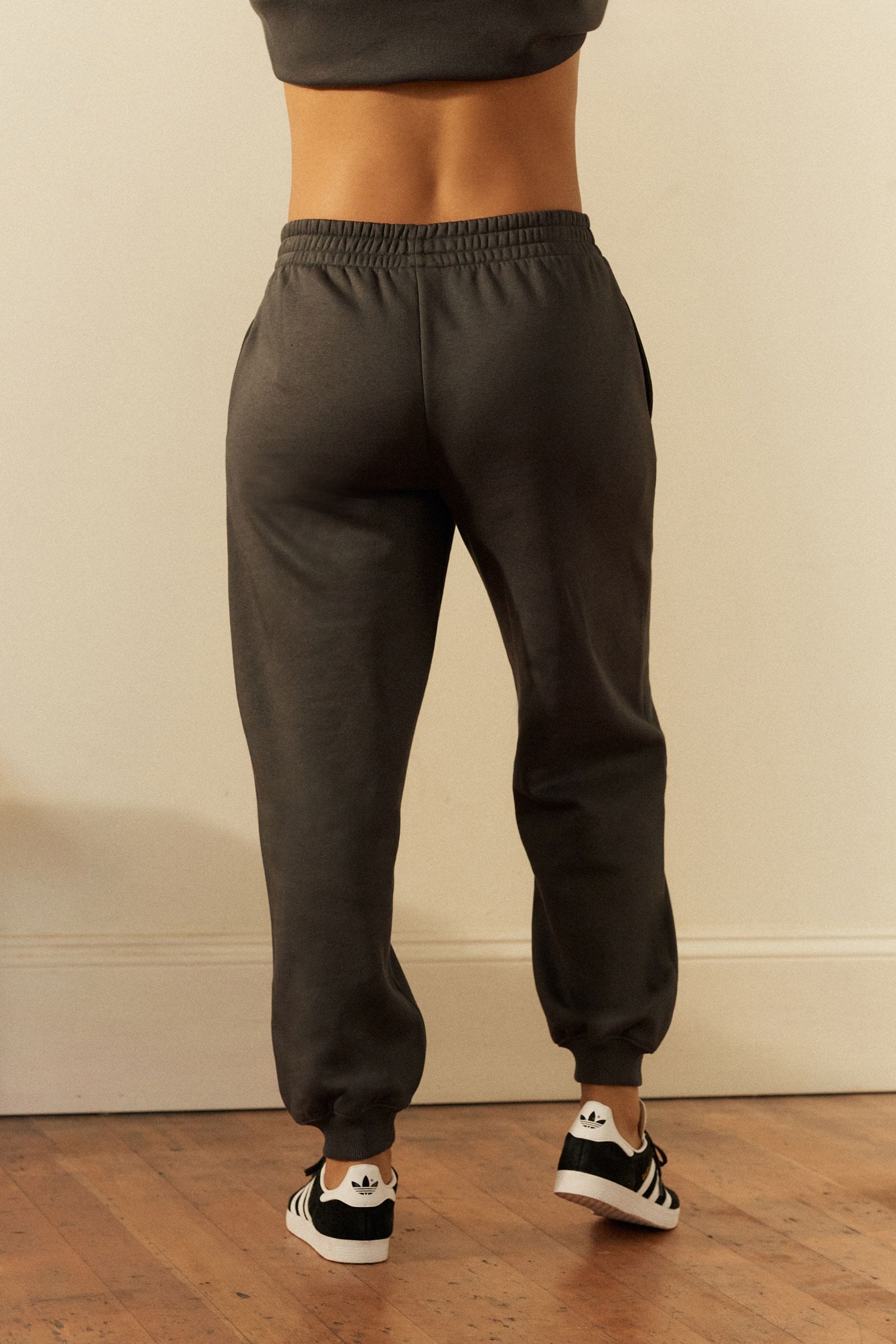Buy Grey Charcoal Relaxed Fit Cuffed Wellness Slogan Graphic Track Joggers from the Next UK online shop