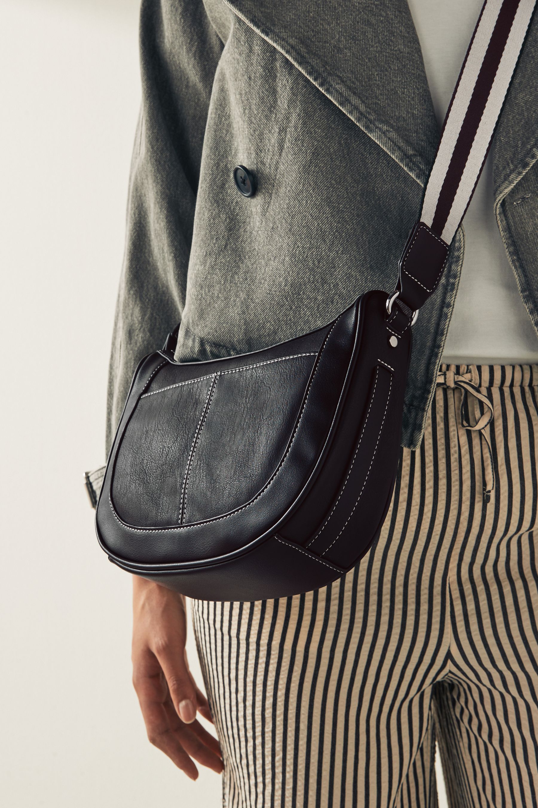 Black cross body saddle bag top