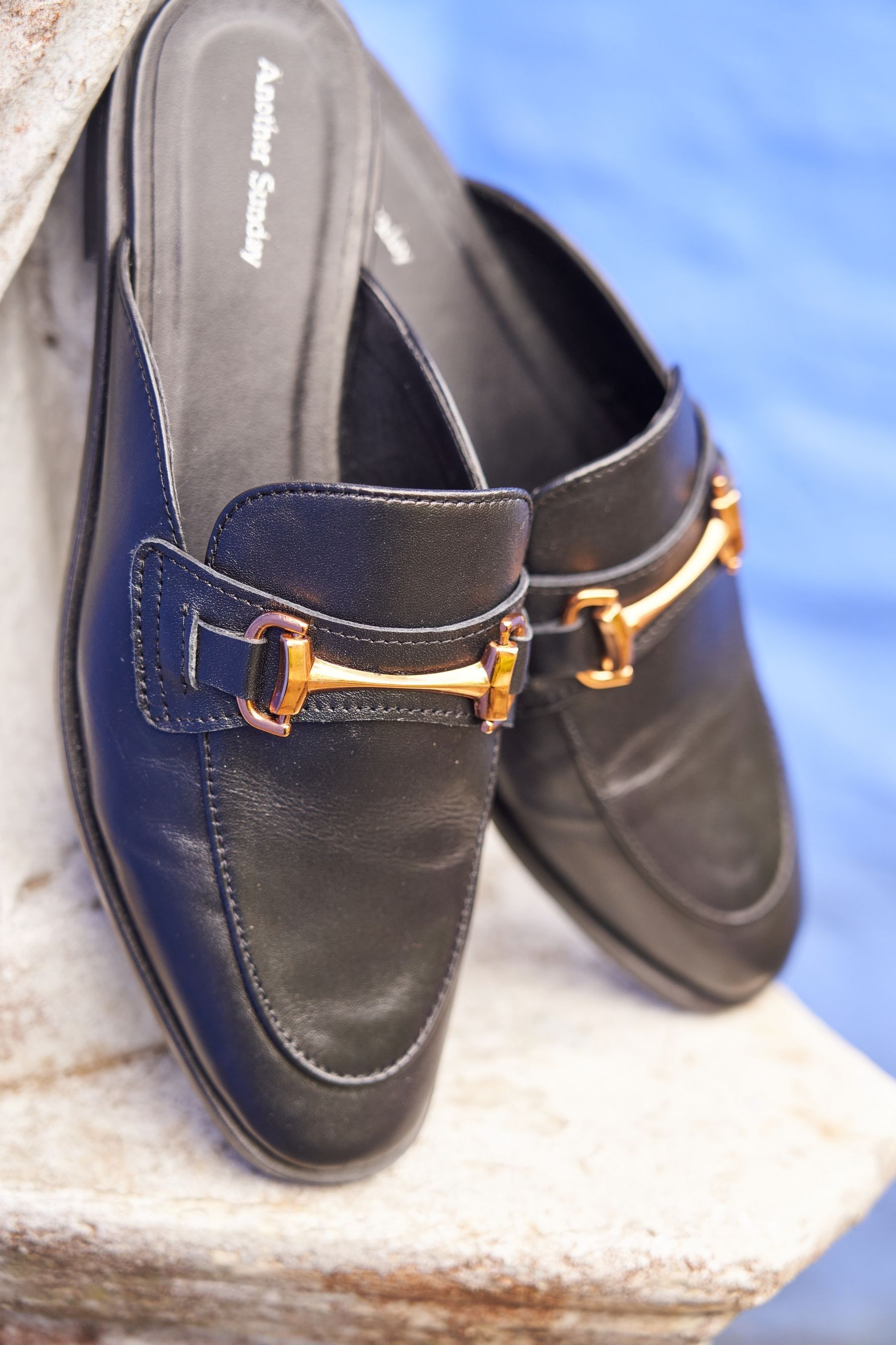 Black loafers with gold buckle shop
