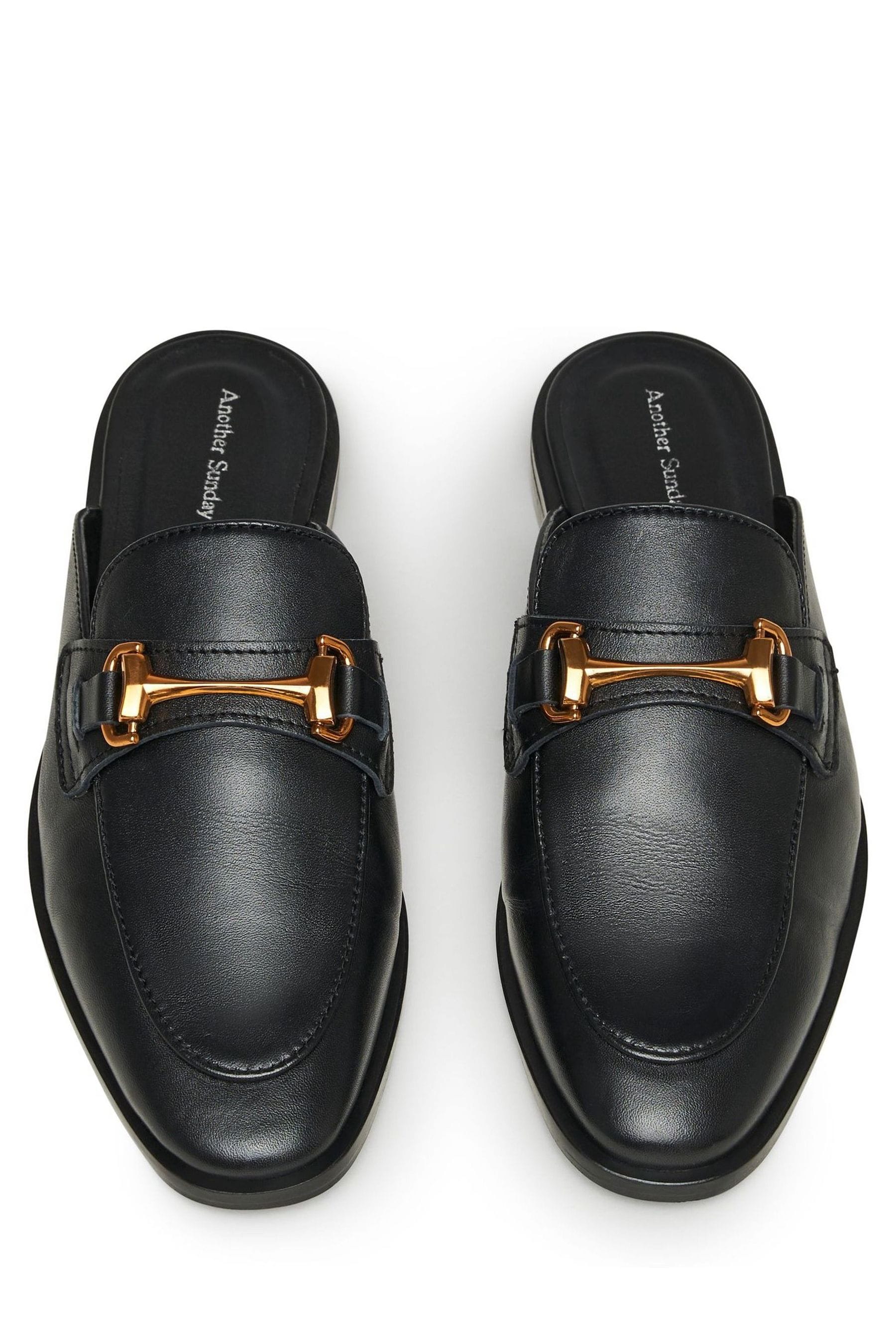 Black loafers shop with gold buckle