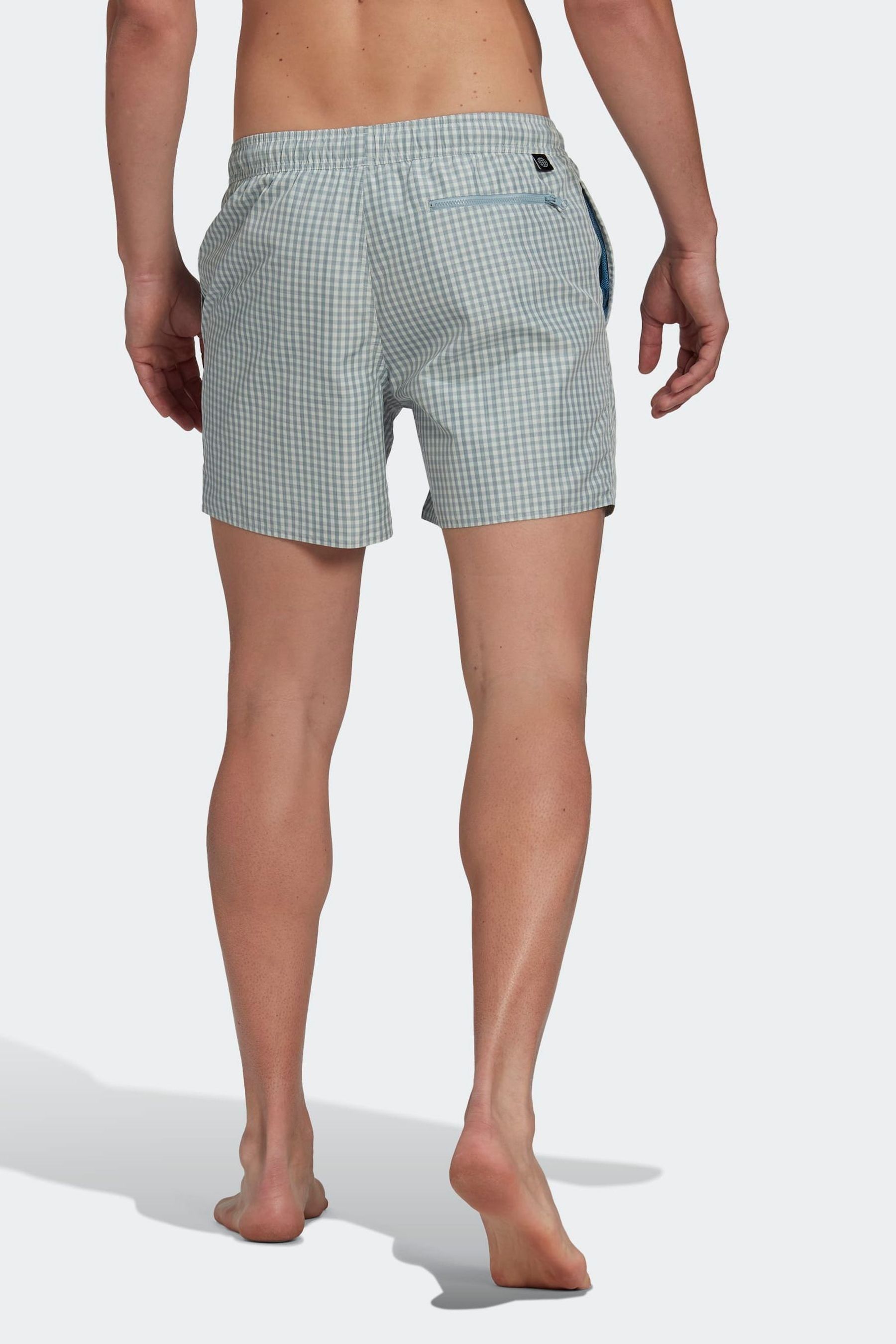 Buy adidas Green Check Swim Shorts from the Next UK online shop