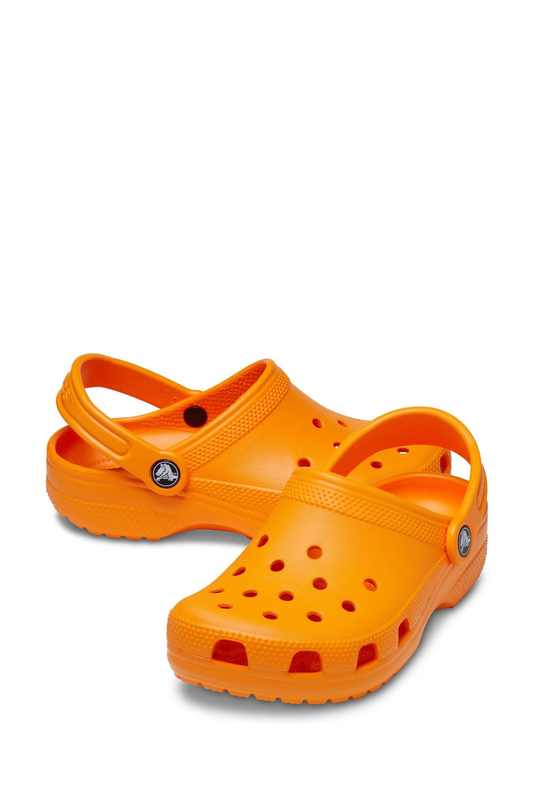 Orange croc flip hotsell flops