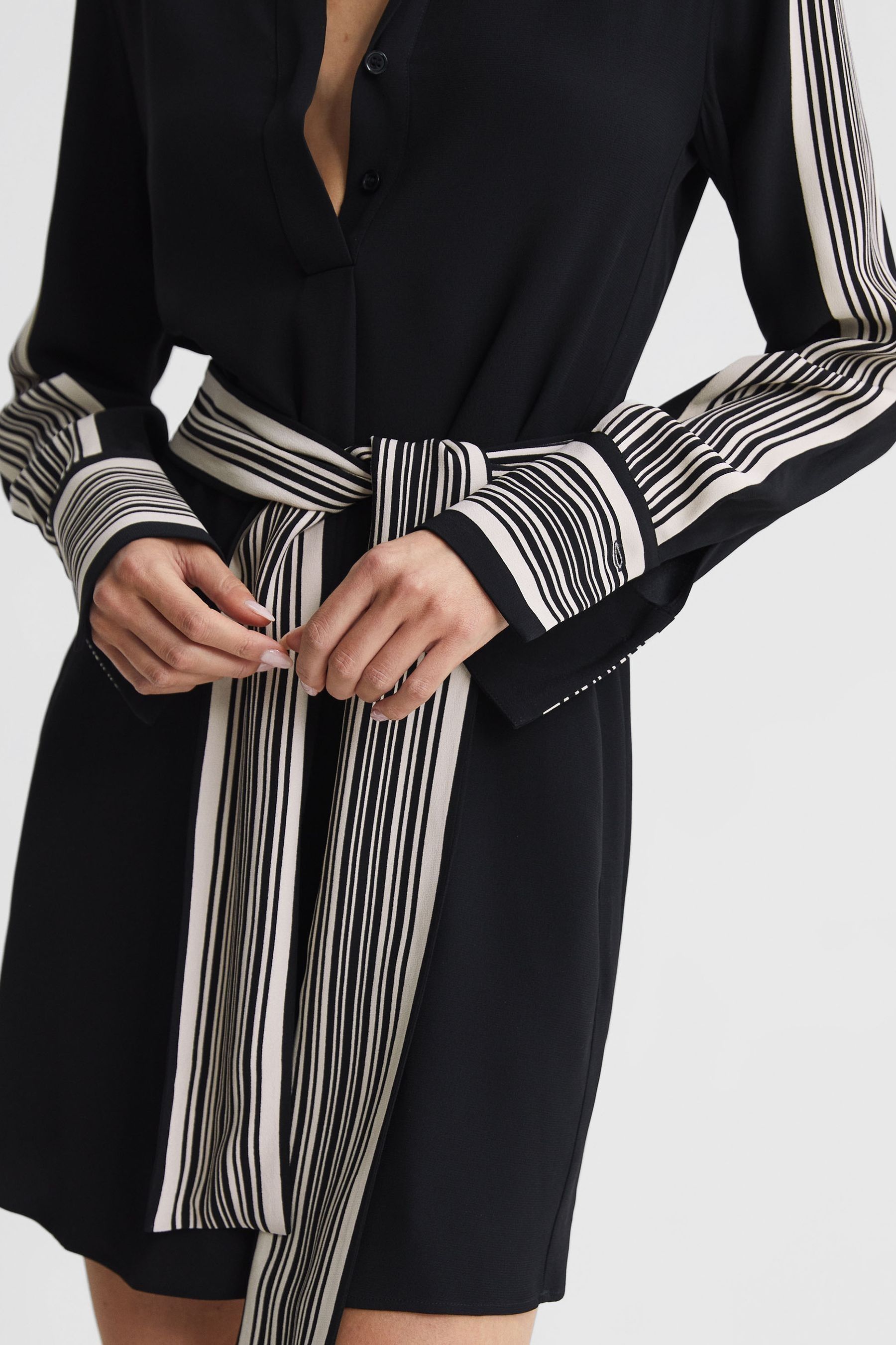 Black dress with stripes on the side 2025