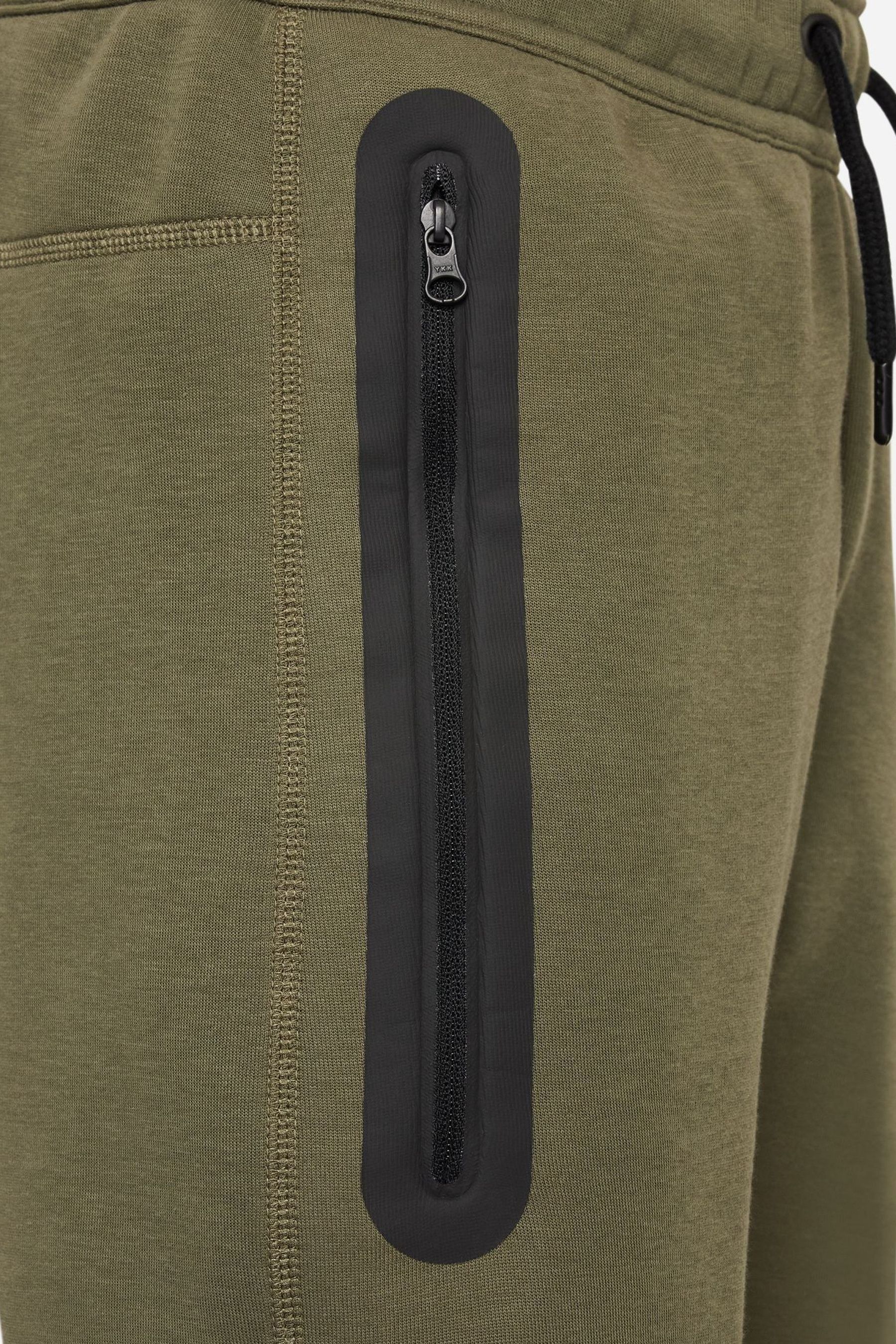 Olive green nike shop tech fleece pants
