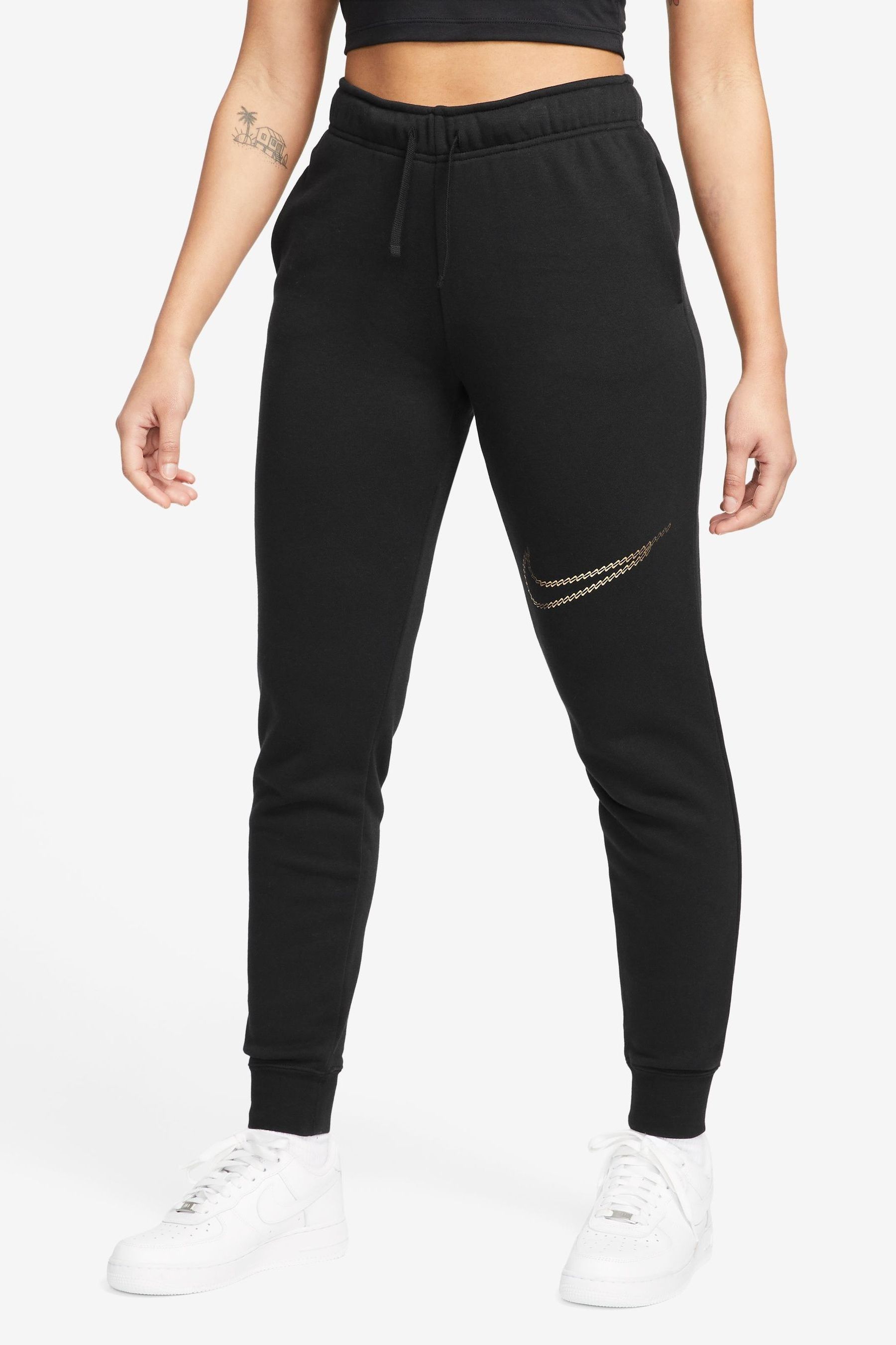 Buy Nike Black Metallic Swoosh Mid Rise Joggers from the Next UK