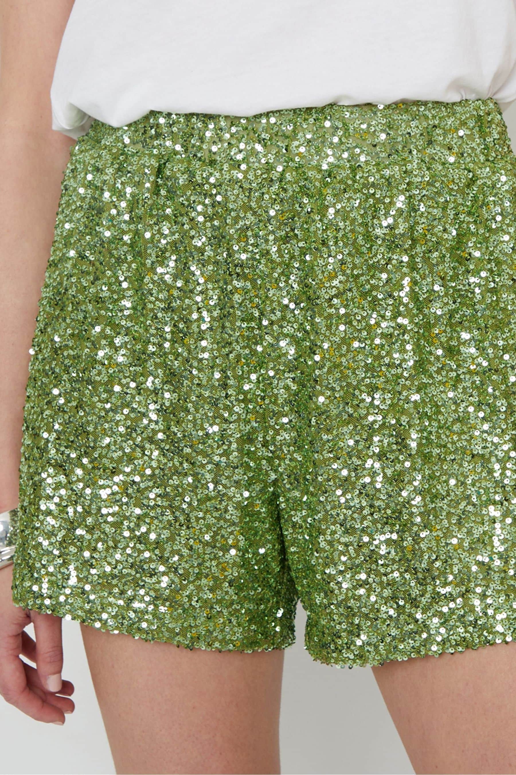 Green sequin shorts top