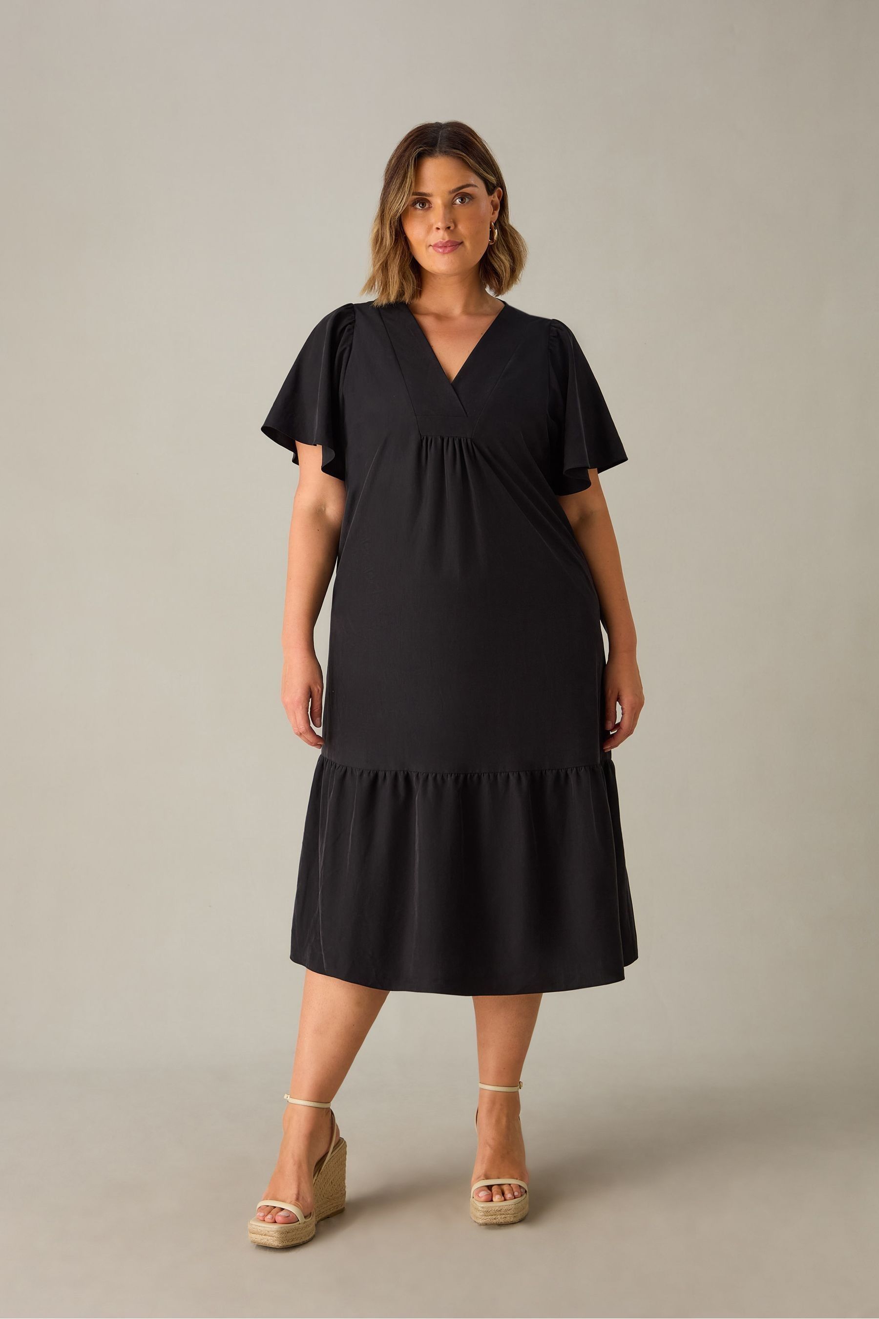 Buy Live Unlimited Black Curve Ruffle Sleeve V Neck Midi Dress from the Next UK online shop