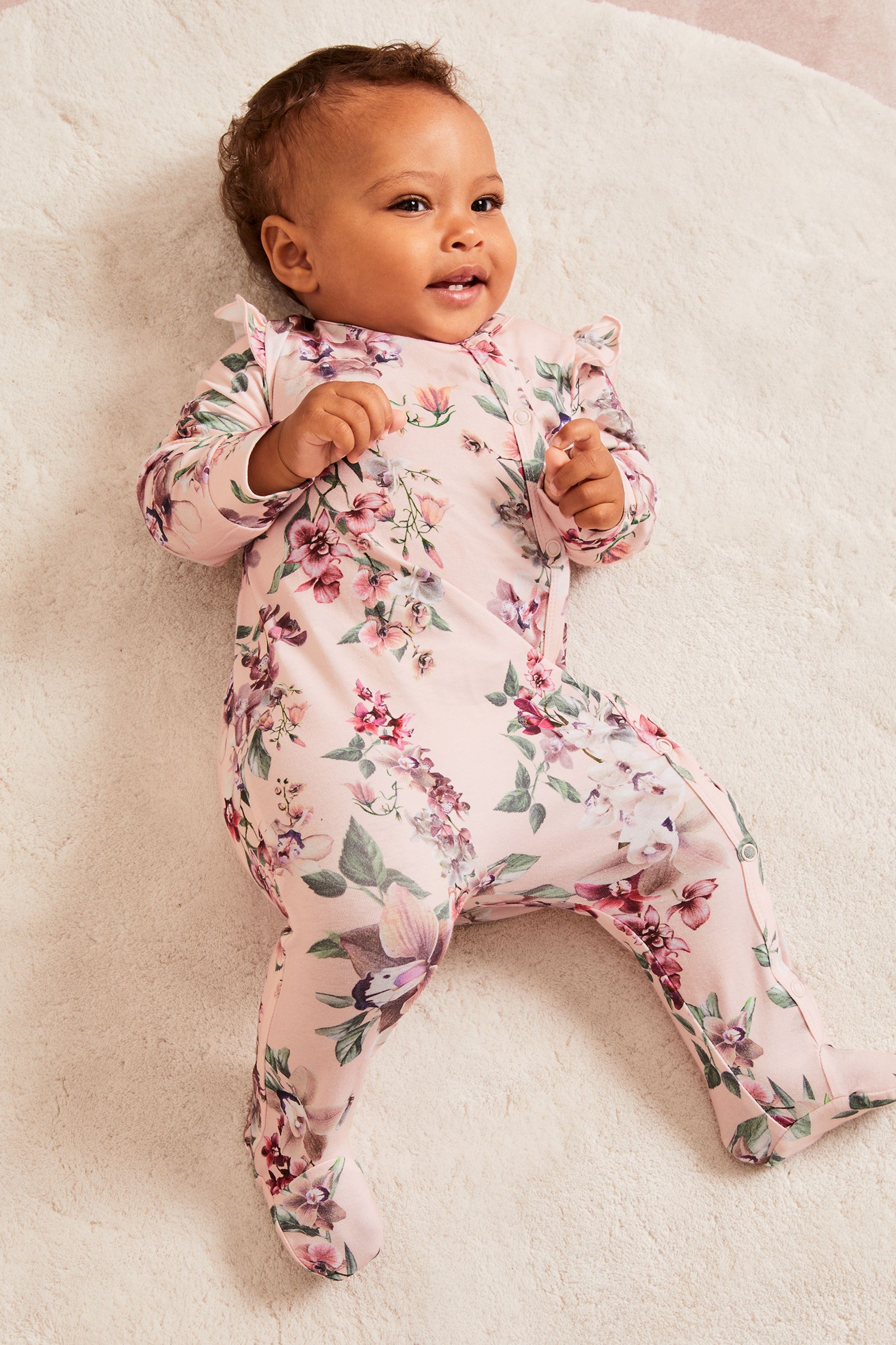 Buy Lipsy Light Pink Floral Baby Sleepsuit from the Next UK online