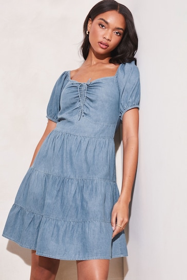 Buy Lipsy Blue Chambray Ruched Sweatheart Puff Sleeve Tiered Mini Dress  from the Next UK online shop