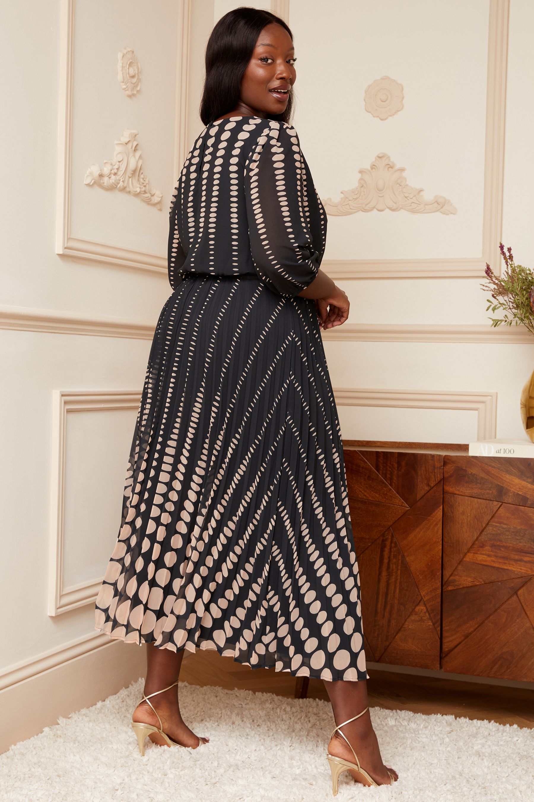 Black and white outlet spotted midi dress