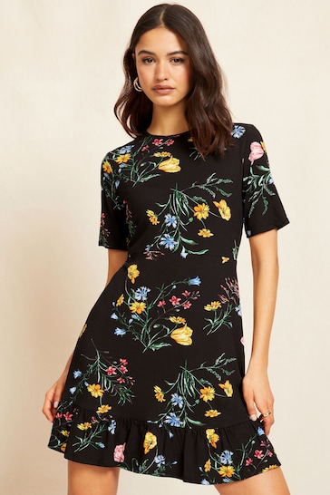 Friends Like These Black Floral Print Short Sleeve Ruffle Hem Jersey Mini Dress