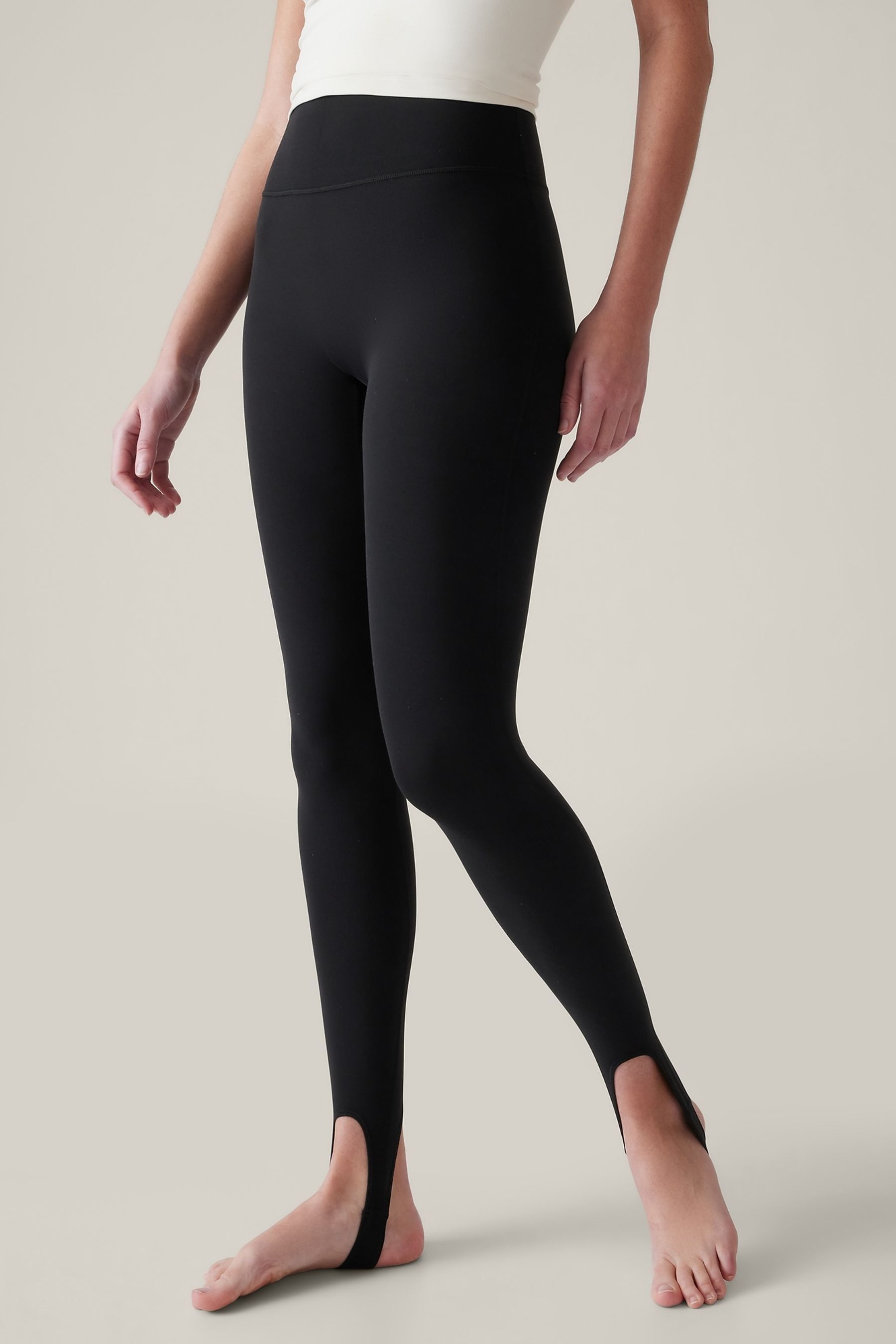 Buy Athleta Black Transcend Mid Rise Stirrup Leggings from the
