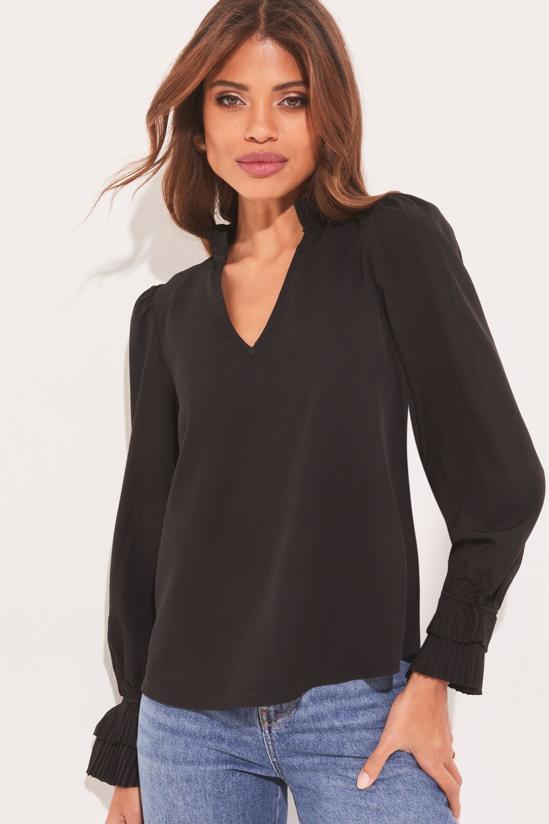 Ruffle v on sale neck
