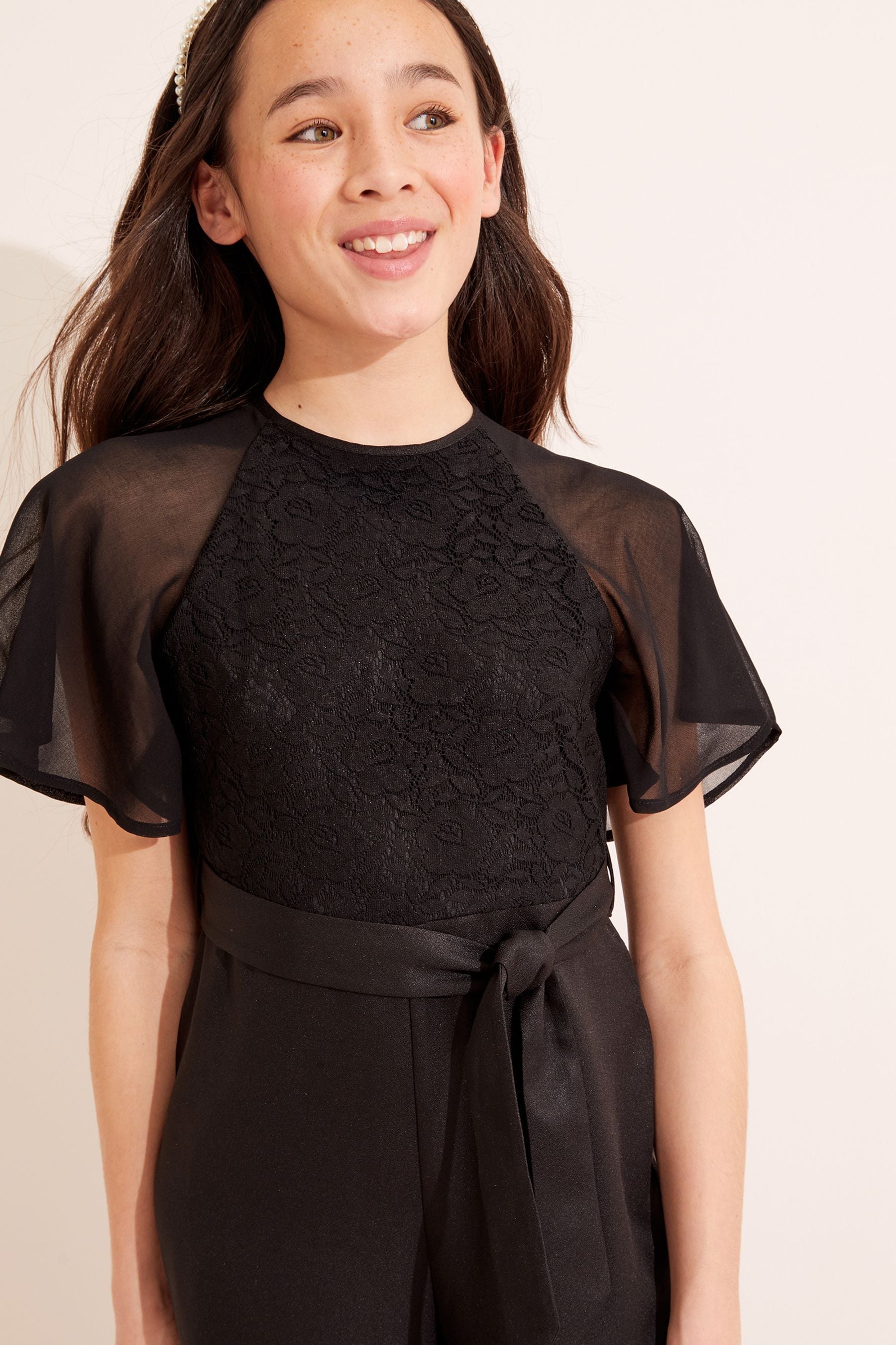 Buy Lipsy Black Lace Front Tie Short Flutter Sleeve Jumpsuit from