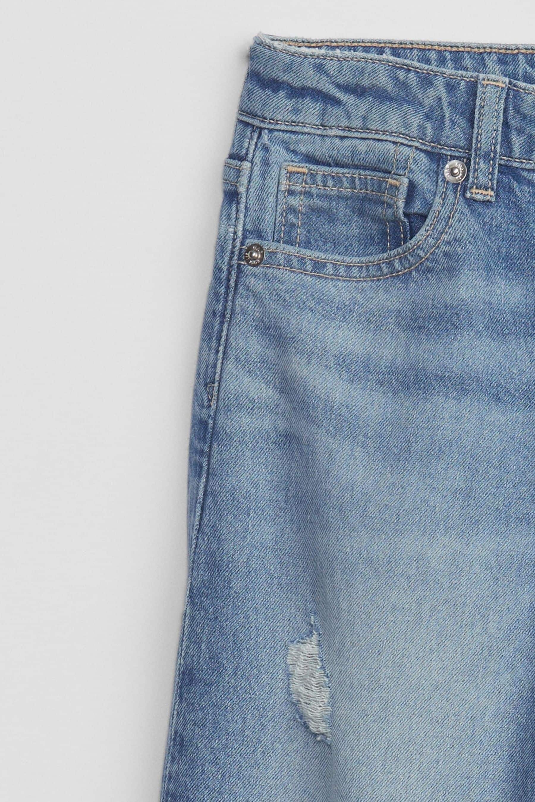 Jeans with distressed store ankles