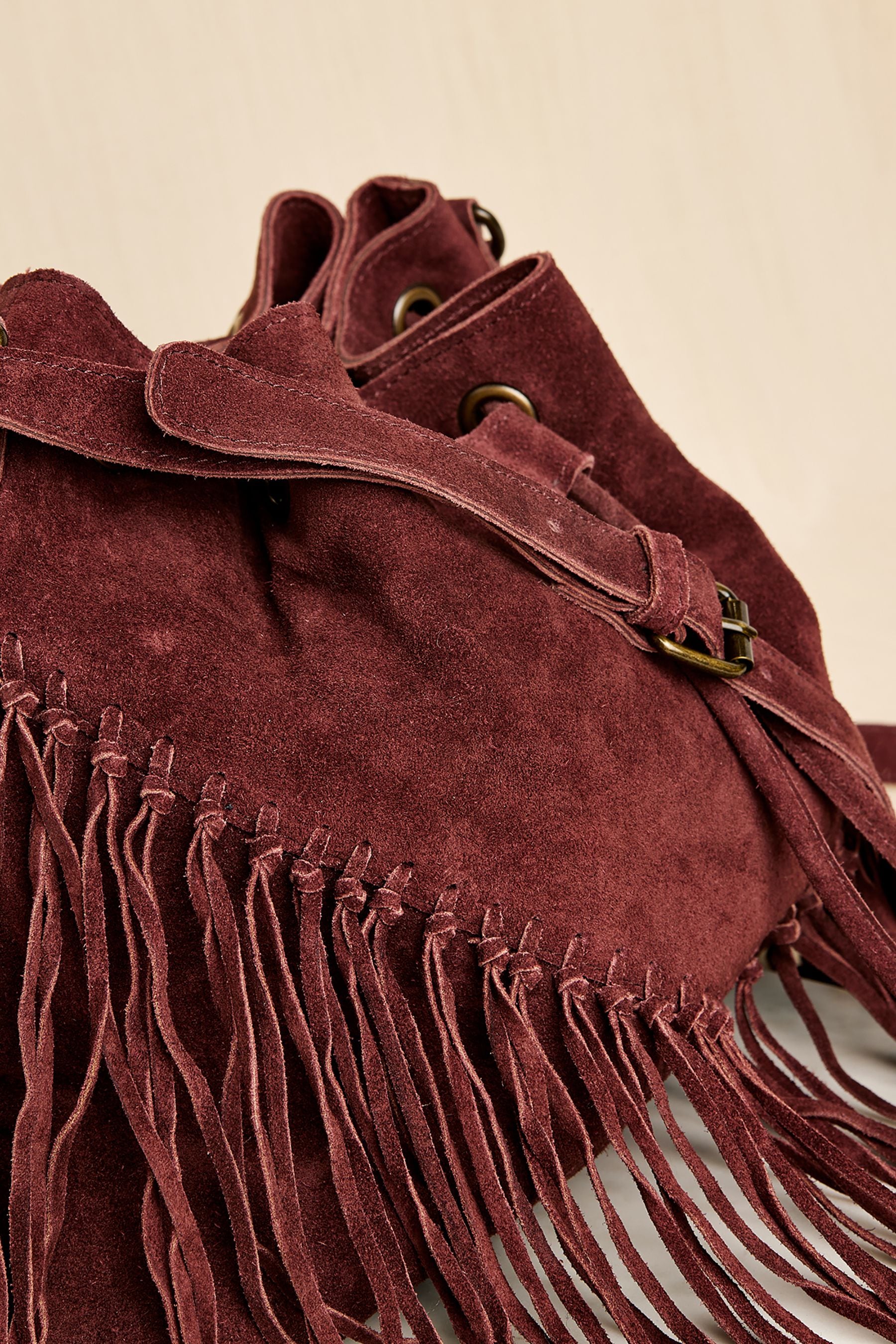 Buy Apricot Red Fringed Suede Bucket Bag from the Next UK online shop