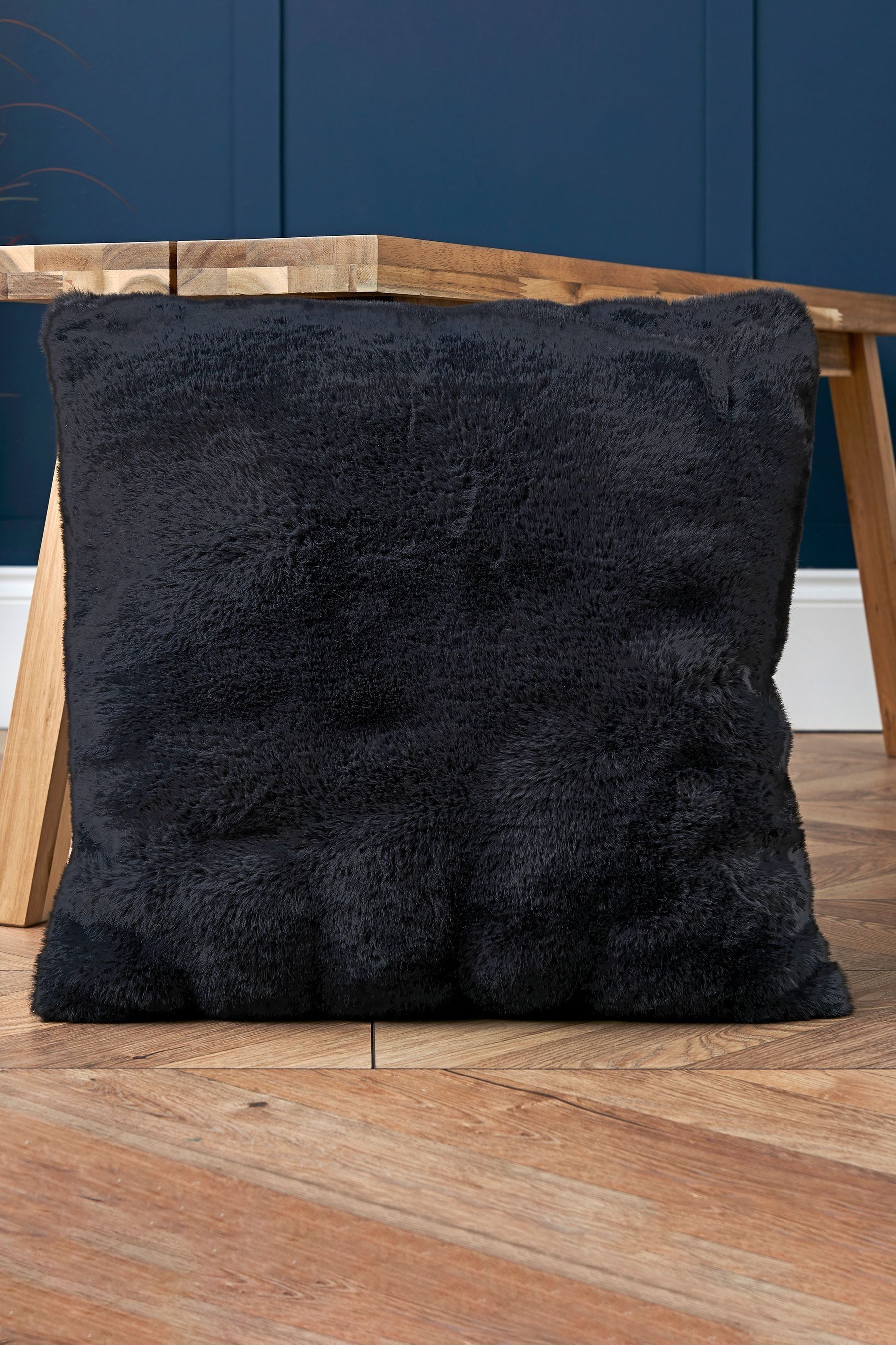 Black fuzzy pillow top
