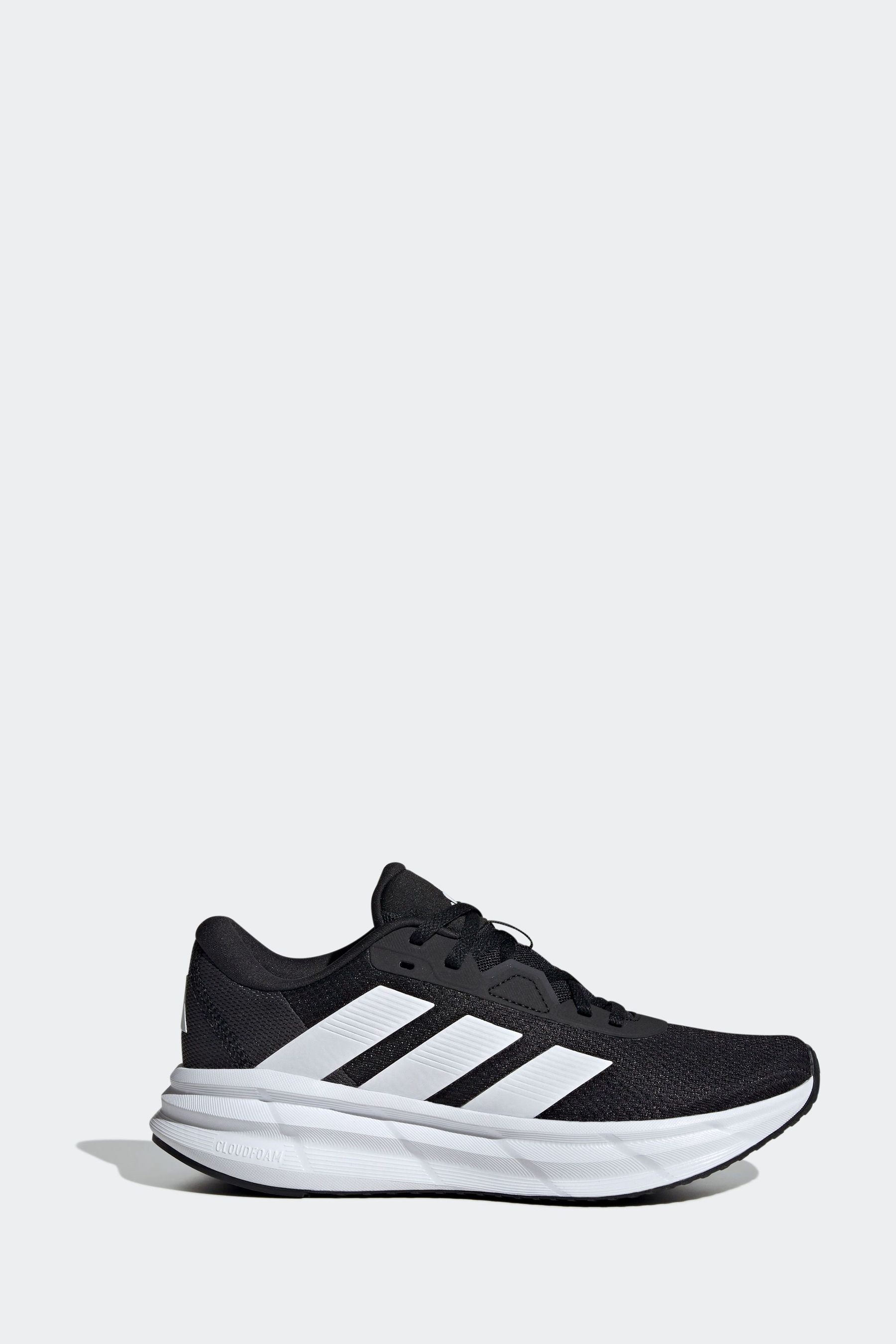 Black and white striped 'running shoes top