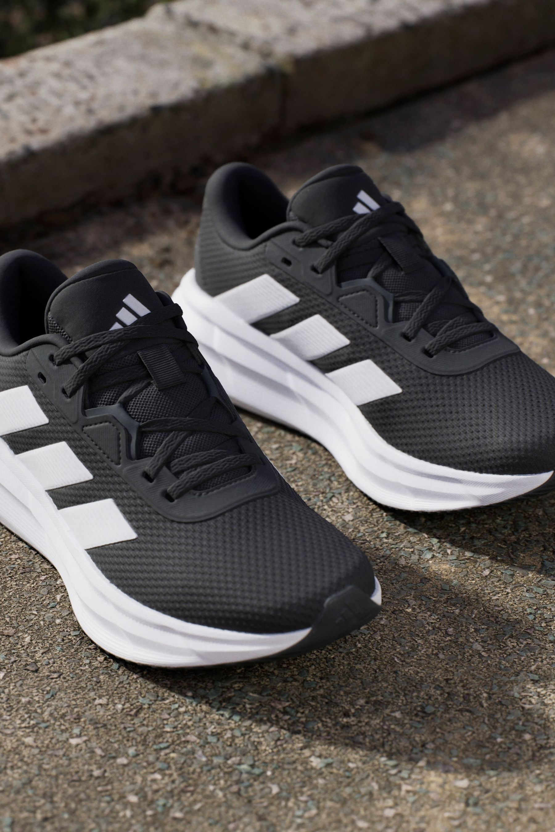 Black and white striped 'running shoes top