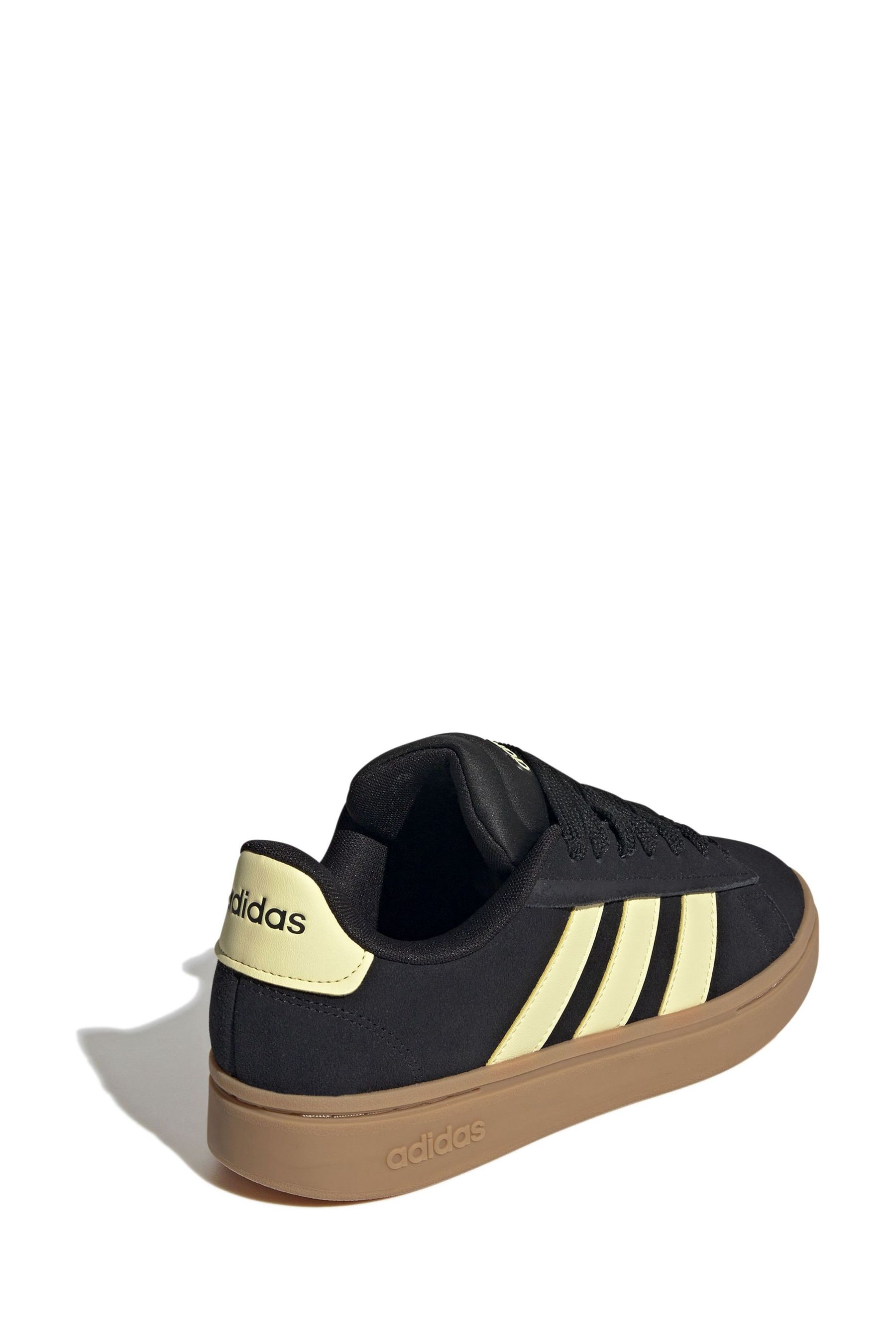 Black and white adidas with brown sole clearance