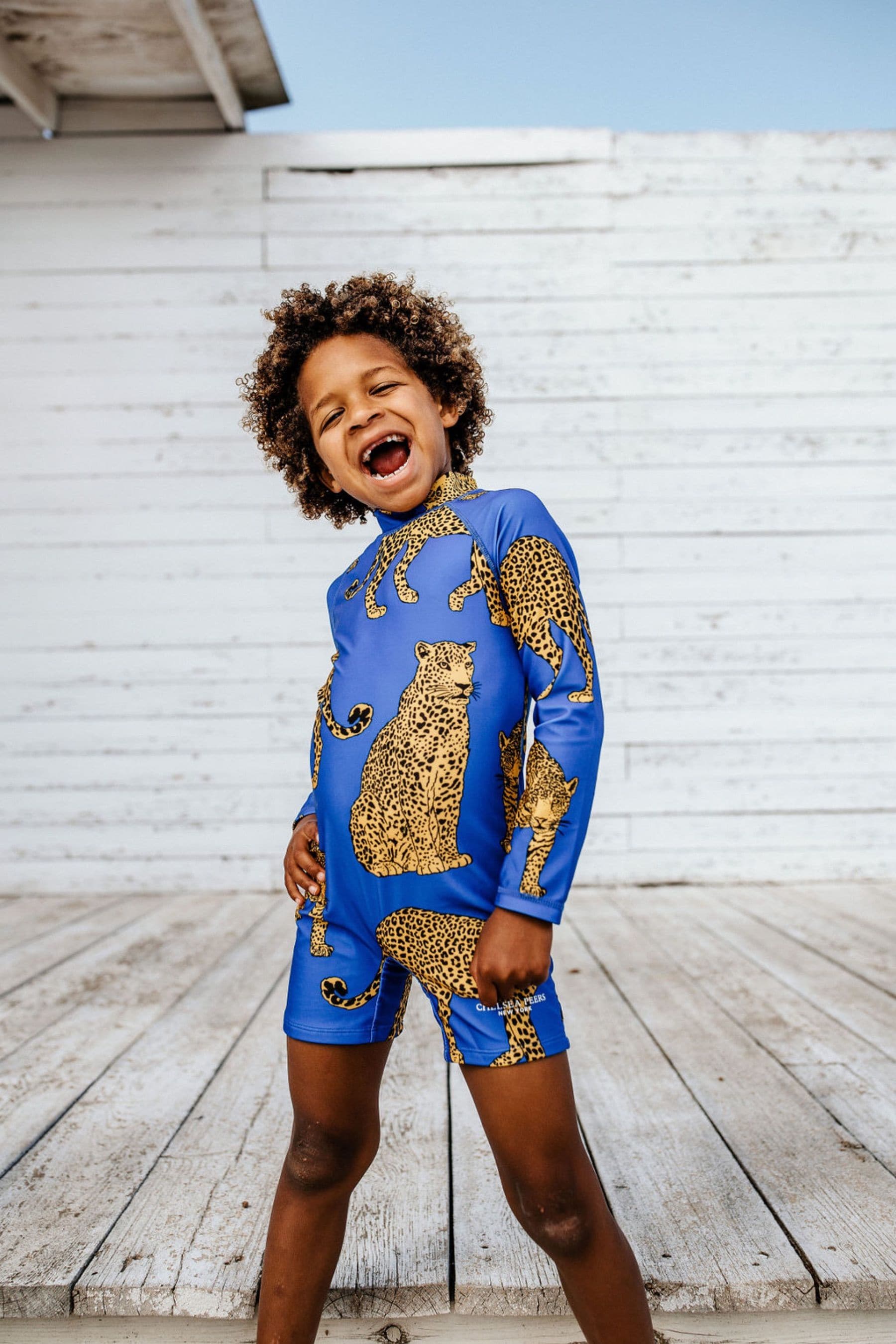 Buy Chelsea Peers Blue Kids Leopard Print Long Sleeve UV Swimsuit