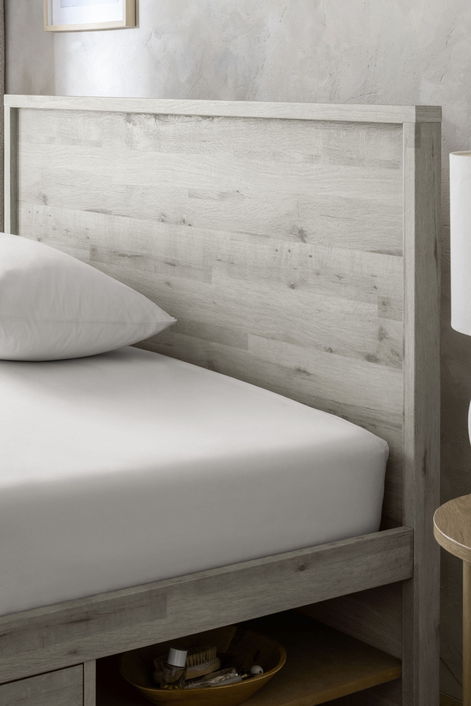 Gray platform bed with clearance drawers