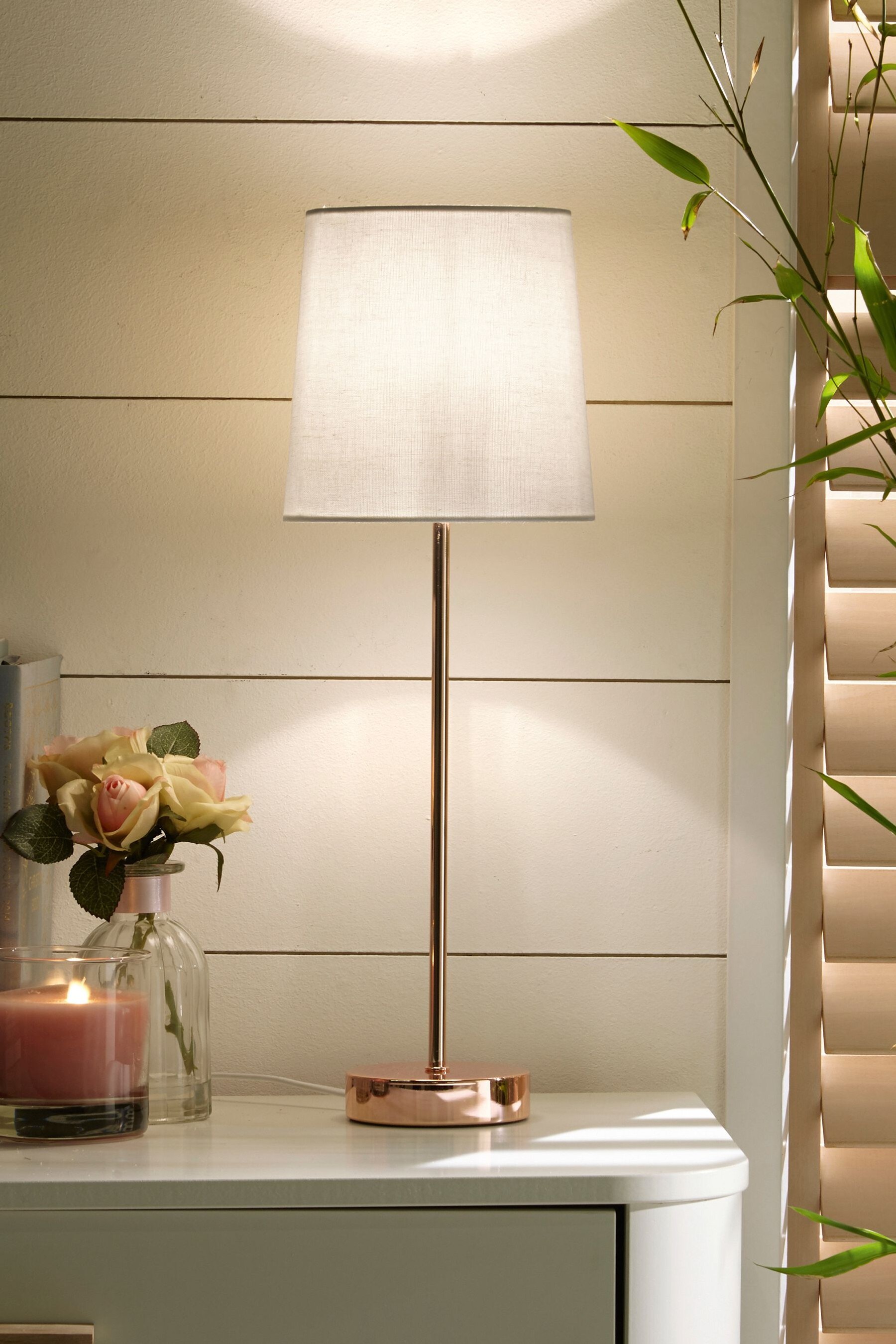 Gold stick shop table lamp
