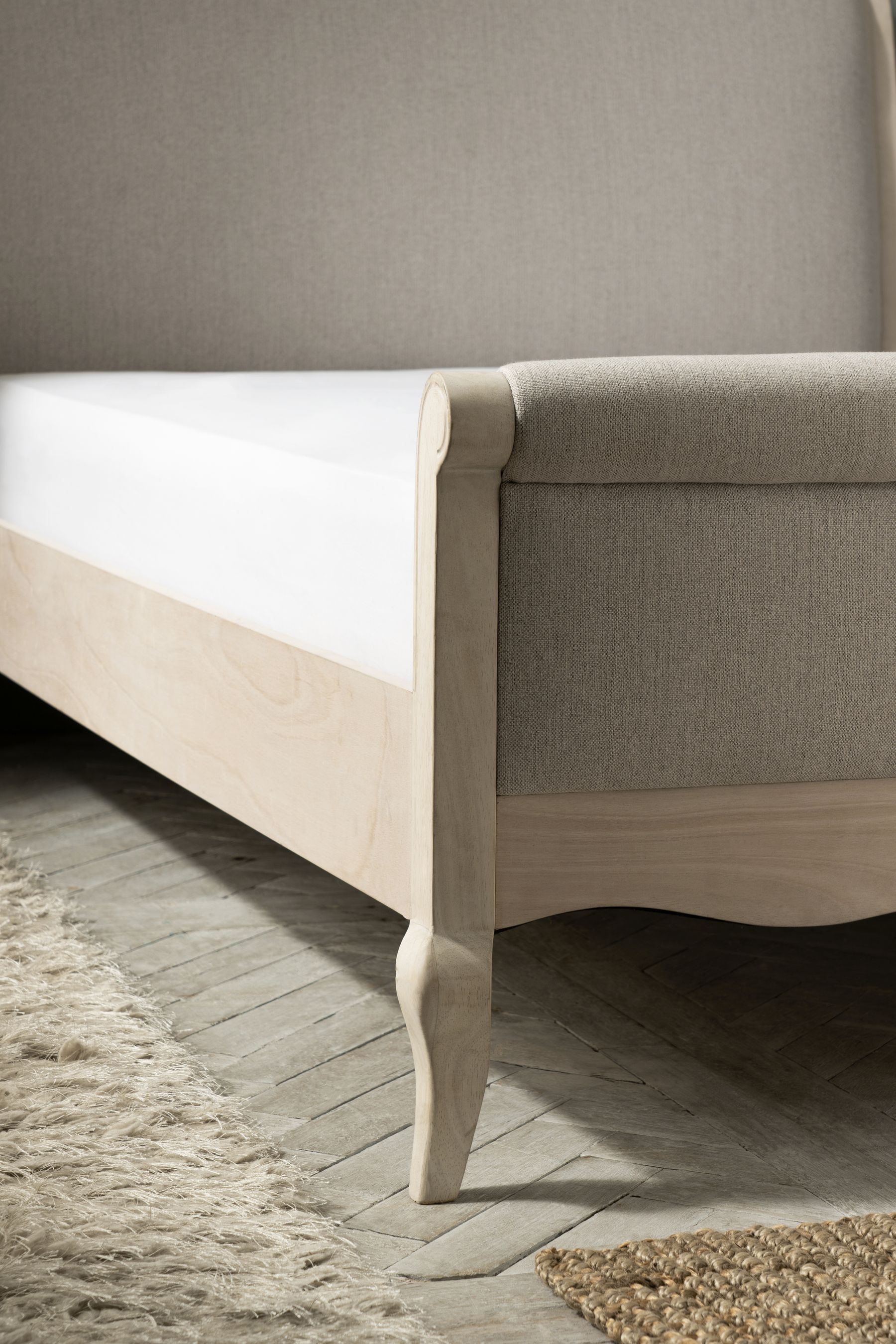White washed sleigh on sale bed