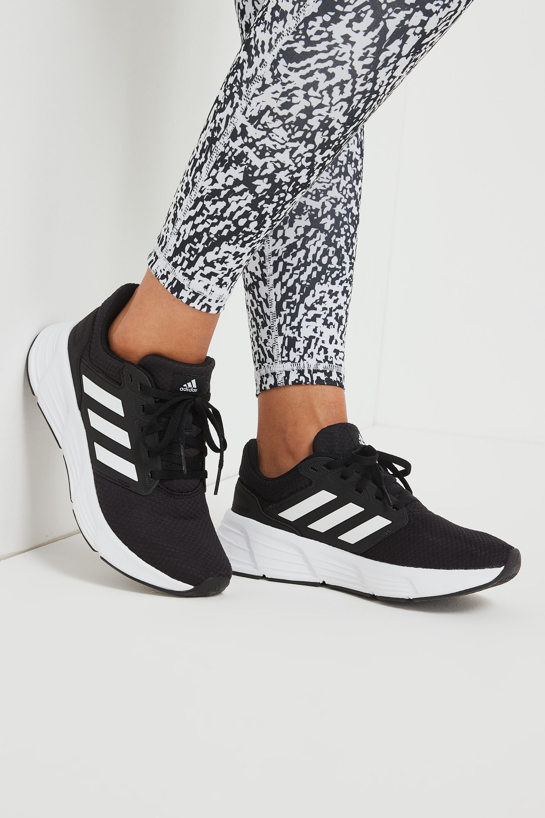 Black and white adidas cheap running shoes